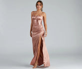 Turn heads at Prom 2025 in this copper prom dress, where statement-making details meet the iconic style of the Brooklyn Satin Ruched Formal Dress .