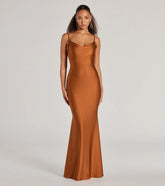 Turn heads at Prom 2025 in this copper prom dress, where statement-making details meet the iconic style of the Virginia Cowl Neck Tie-Back Mermaid Formal Dress .