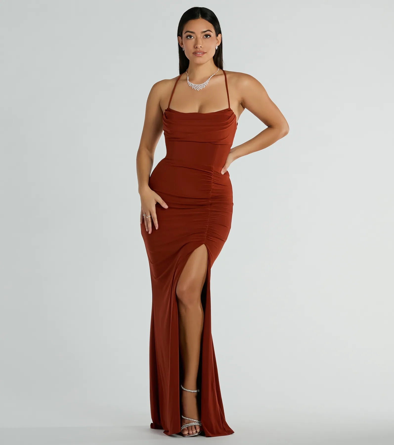 Turn heads at HOCO 2025 in this rust homecoming dress, where statement-making details meet the iconic style of the Ashley Sleeveless Bow Mermaid Formal Dress.
