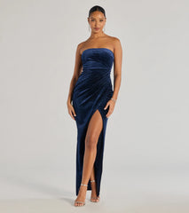 Turn heads at Prom 2025 in this navy blue prom dress, where statement-making details meet the iconic style of the Cordelia Velvet Glitter Long Wrap Dress .