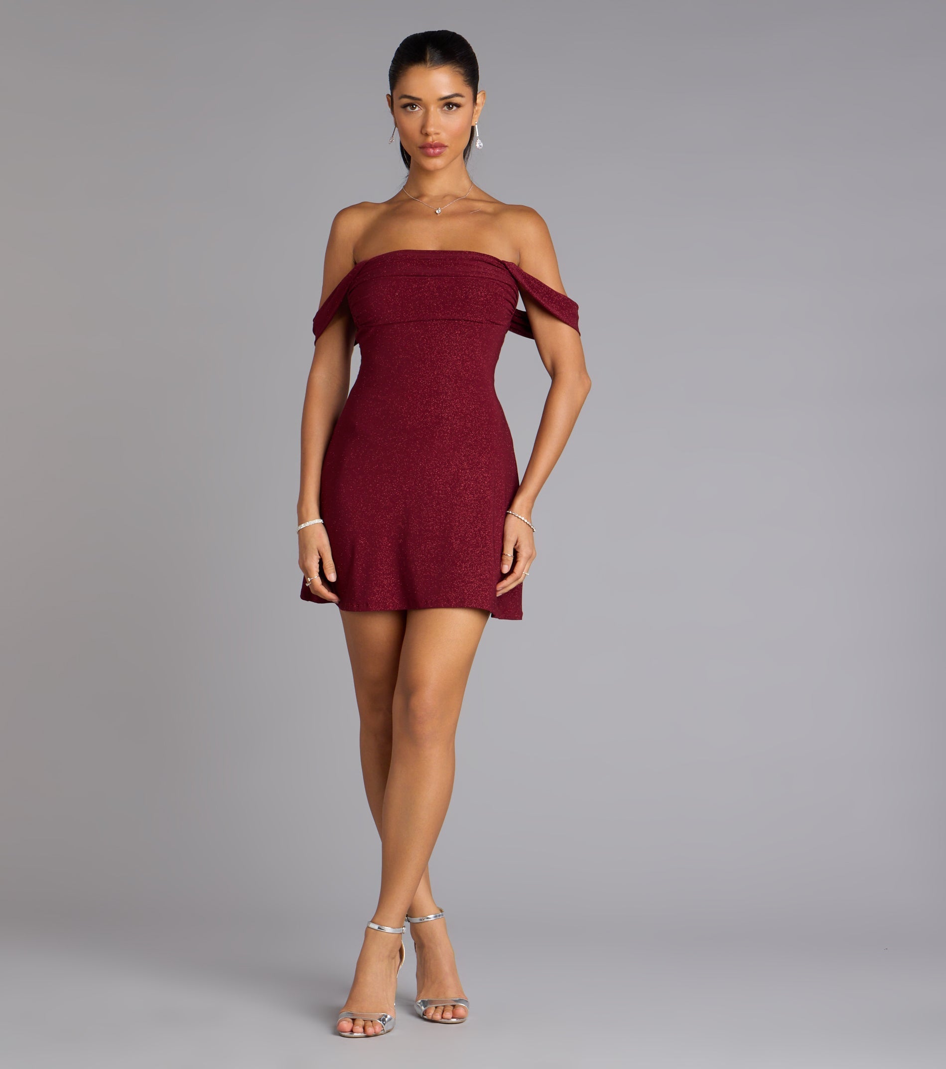 The Classic Glitz Glitter Knit Off-The-Shoulder Mini Dress is your new go-to Windsor dress—effortless, versatile, and made to update your fall style in seconds.