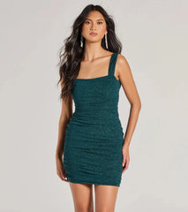 The Impeccable Shine Open Back Glitter Mini Dress is a shimmery hunter glitter dress that catches the light beautifully, perfect for any special outfit like formal attire, clubwear, or a wedding guest dress.