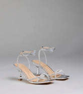 Style made simple with the Fab Icon Butterfly Rhinestone Stiletto Heels in silver, trendy women’s shoes that take your outfit from basic to bold in one step.