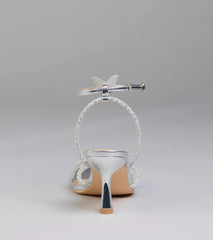 Elevate warm-weather looks with Fab Icon Butterfly Rhinestone Stiletto Heels in silver, a pair of trendy sandals bringing chic, modern flair to every step.