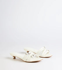 Style made simple with the Trendy Steps Buckle Strap Kitten Heel Mules in white, trendy women’s shoes that take your outfit from basic to bold in one step.