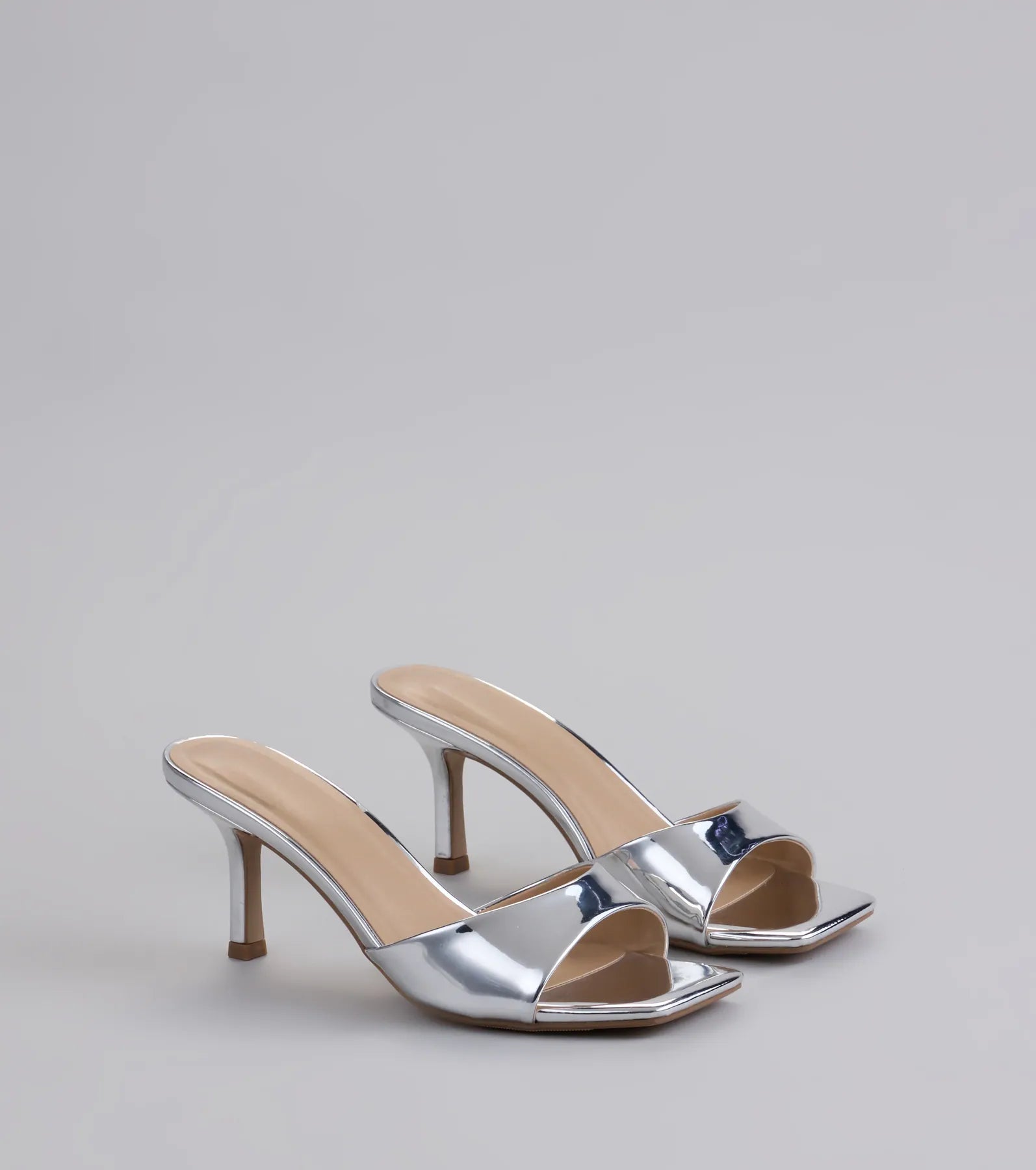 Style made simple with the Glam Stunner Stiletto Mules in silver, trendy women’s shoes that take your outfit from basic to bold in one step.