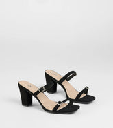 Style made simple with the On The Down Low Rhinestone Buckle Mules in black, trendy women’s shoes that take your outfit from basic to bold in one step.