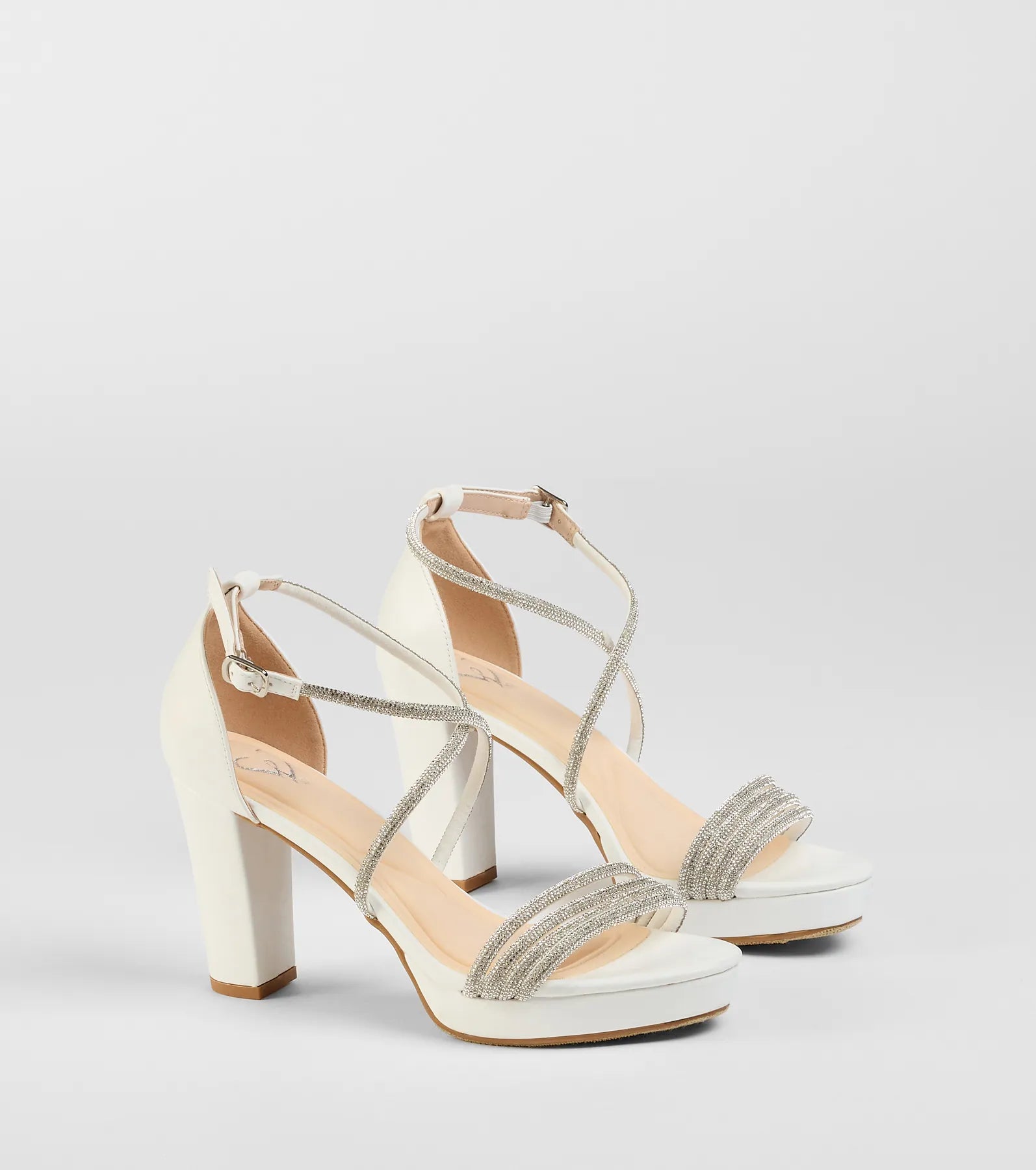 Style made simple with the Night Shimmer Rhinestone Platform Block Heels in white, trendy women’s shoes that take your outfit from basic to bold in one step.