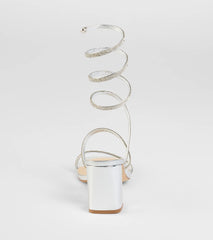 Elevate warm-weather looks with Sparkle And Shine Rhinestone Spiral Block Heels in silver, a pair of trendy sandals bringing chic, modern flair to every step.