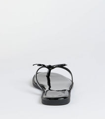 Elevate warm-weather looks with Dainty Looks Bow Thong Sandals in black, a pair of trendy sandals bringing chic, modern flair to every step.