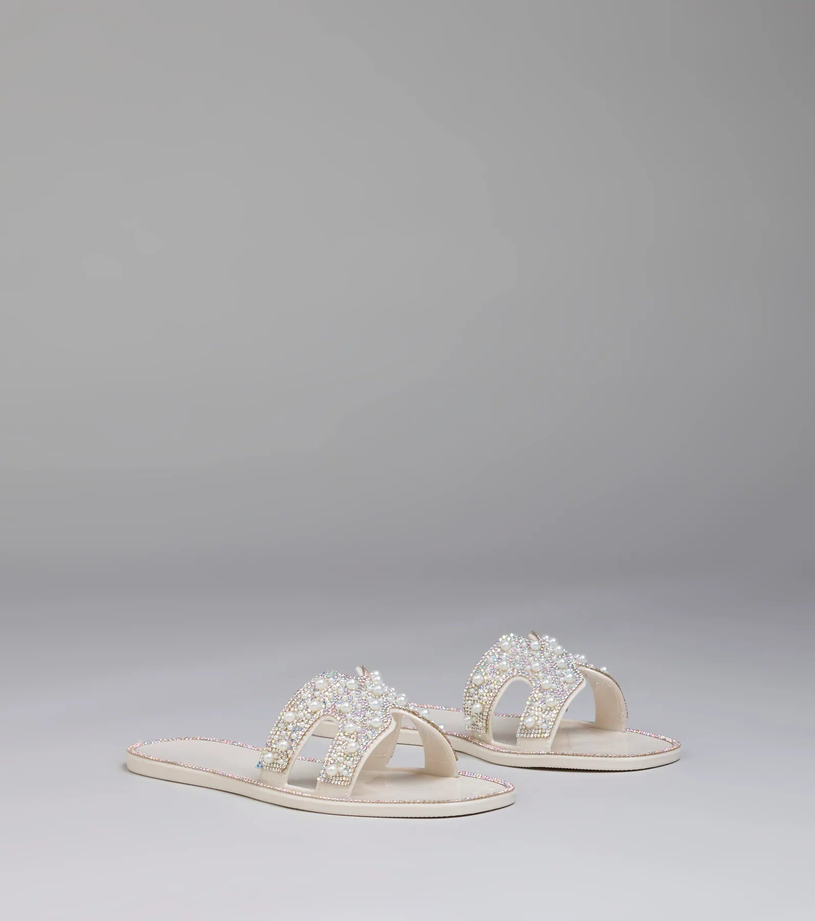 Style made simple with the Pop Of Luxe Sparkle Faux Pearl Rhinestone Sandals in ivory, trendy women’s shoes that take your outfit from basic to bold in one step.