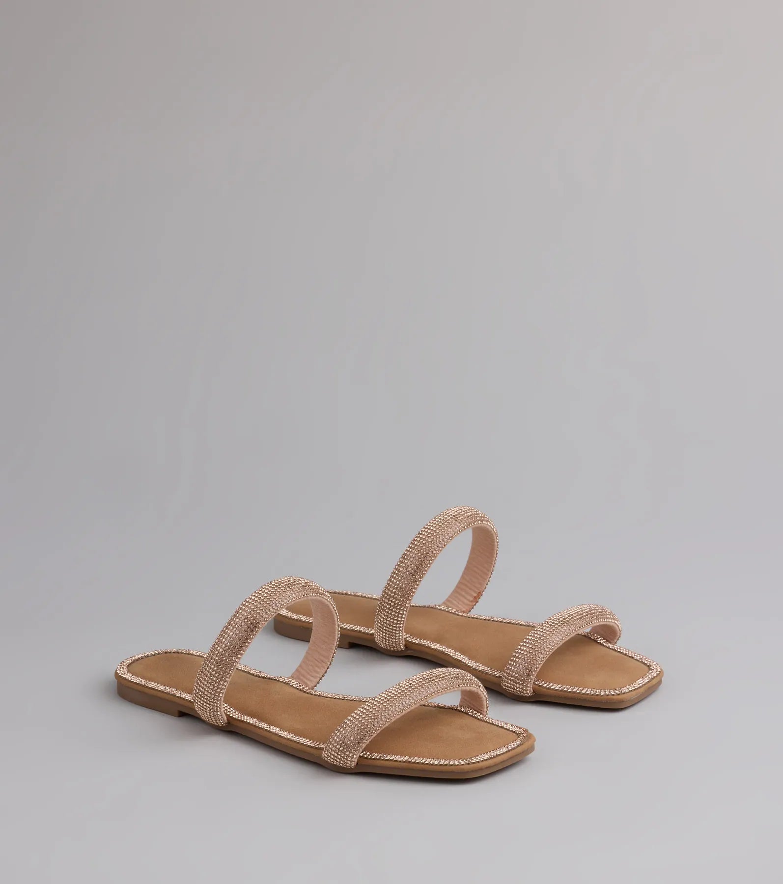 Style made simple with the Step Into Glam Rhinestone Sandals in rose gold, trendy women’s shoes that take your outfit from basic to bold in one step.