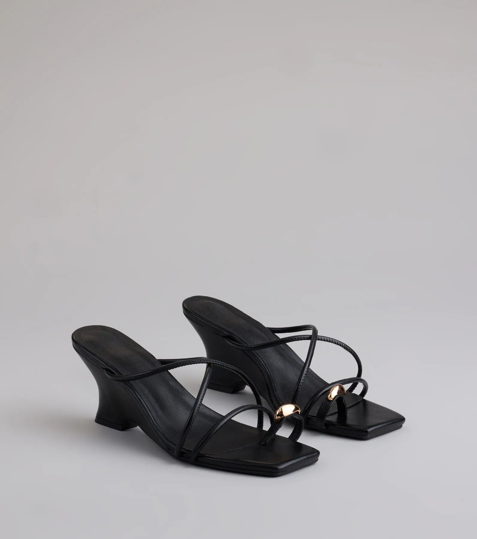 Style made simple with the Refined And Classy Toe Ring Strappy Wedges in black, trendy women’s shoes that take your outfit from basic to bold in one step.