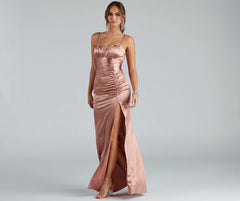 Turn heads at Prom 2025 in this copper prom dress, where statement-making details meet the iconic style of the Brooklyn Satin Ruched Formal Dress .