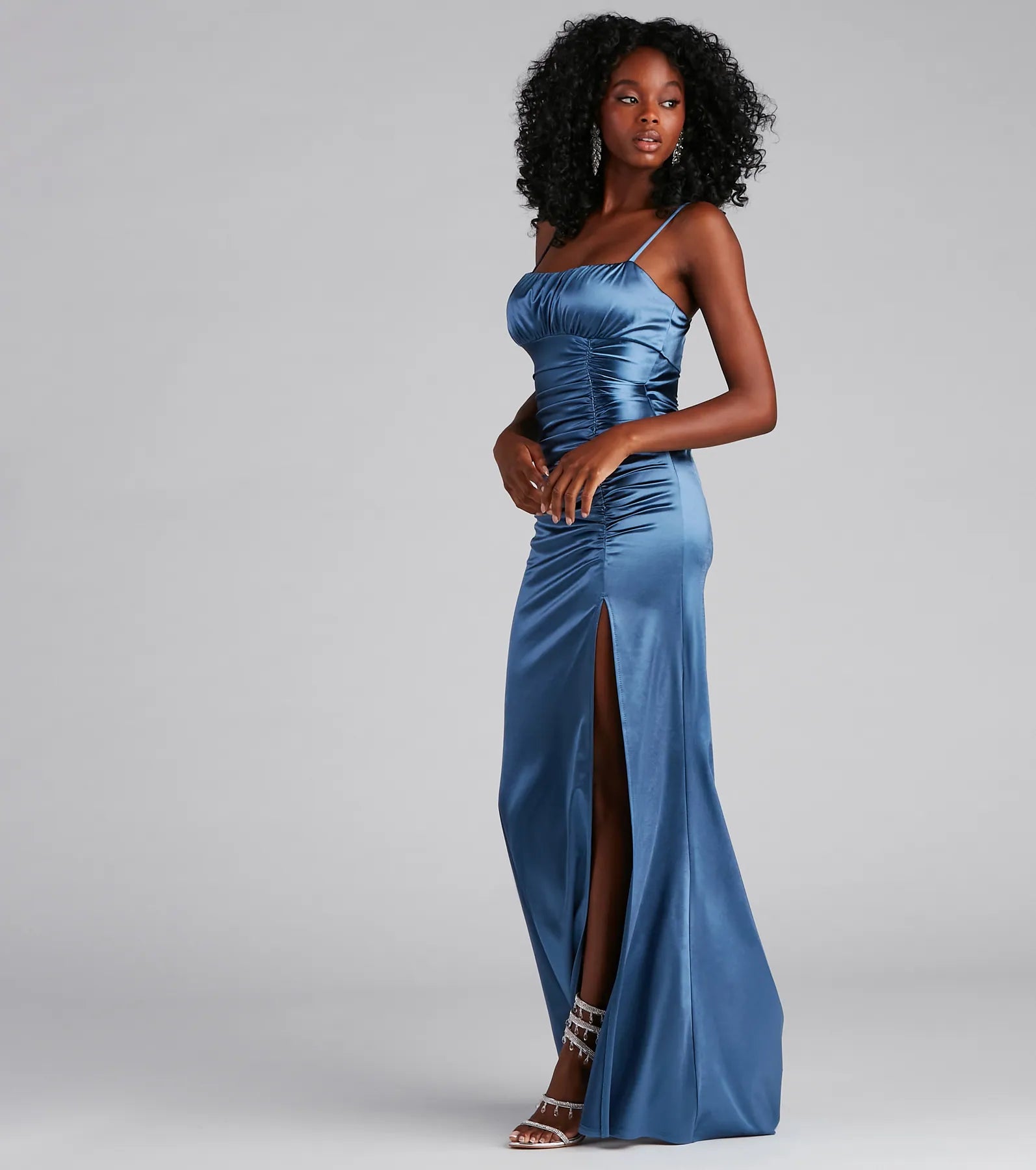 Turn heads at Prom 2025 in this denim prom dress, where statement-making details meet the iconic style of the Brooklyn Satin Ruched Formal Dress .