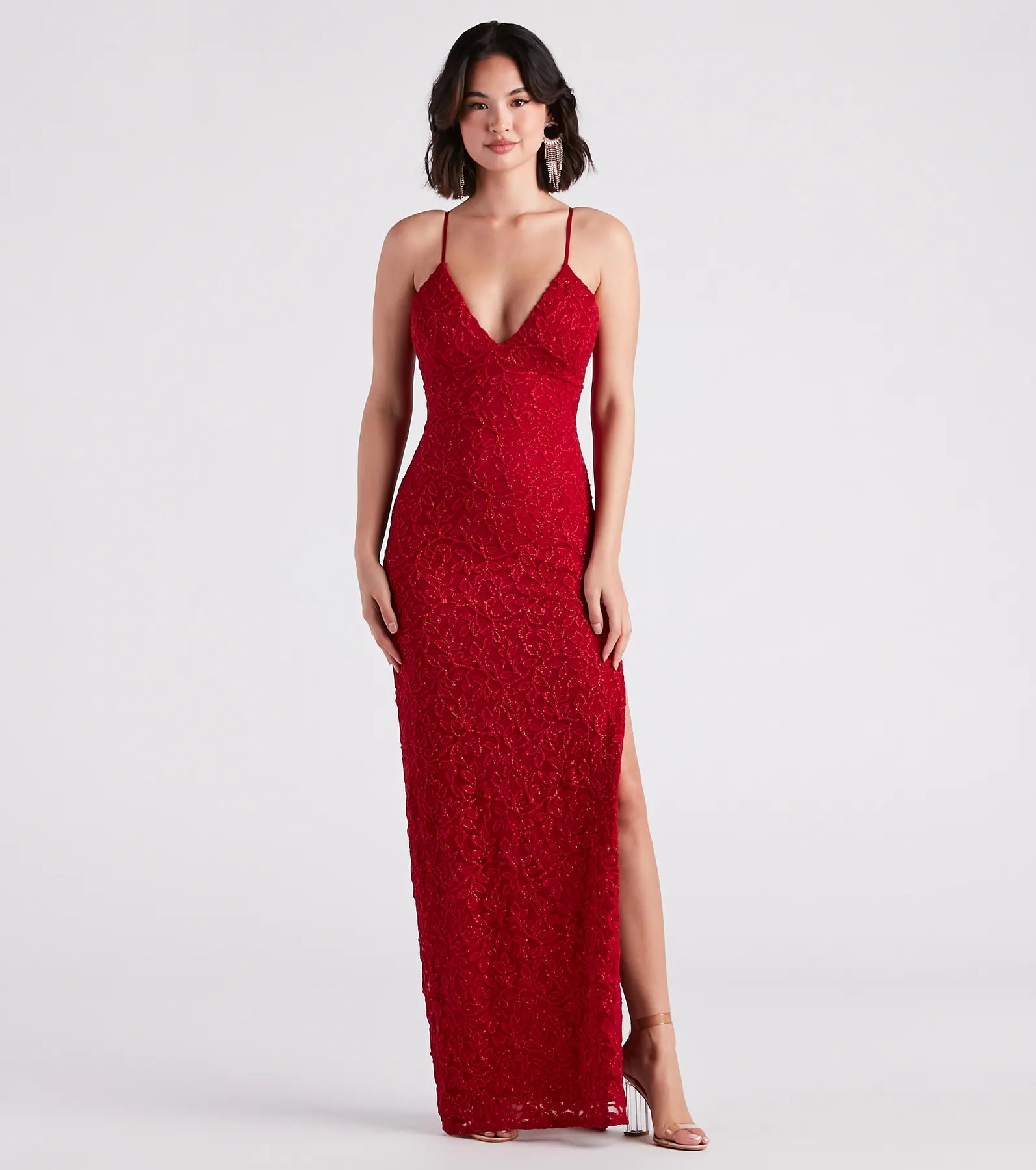 Turn heads at Prom 2025 in this red prom dress, where statement-making details meet the iconic style of the Marylou Lace Mesh Plunge Neck Formal Dress .