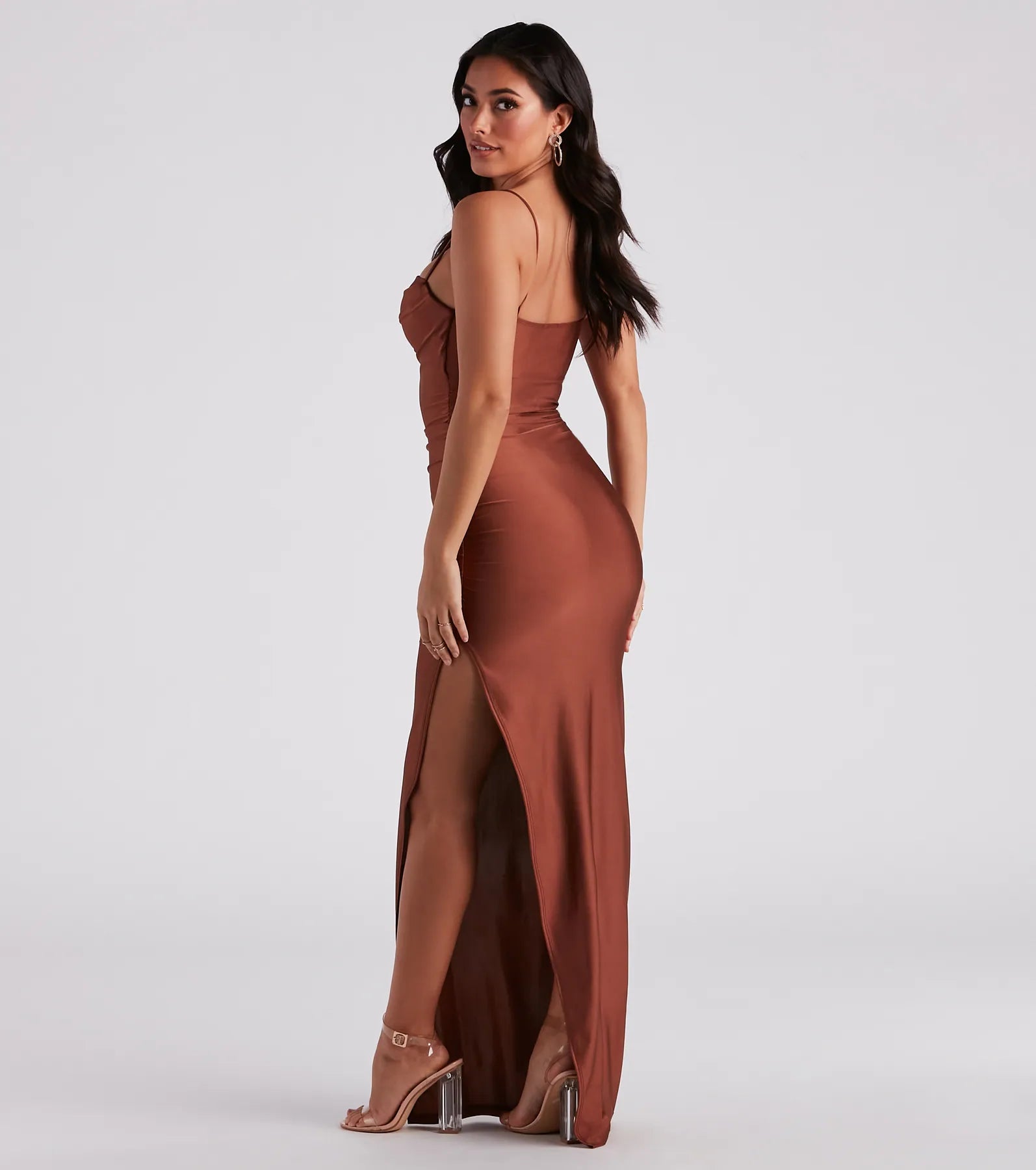 The Ella Cowl Neck Satin Dress is a flowy, brown maxi dress that moves with you from sunny days to elevated nights in effortless style.