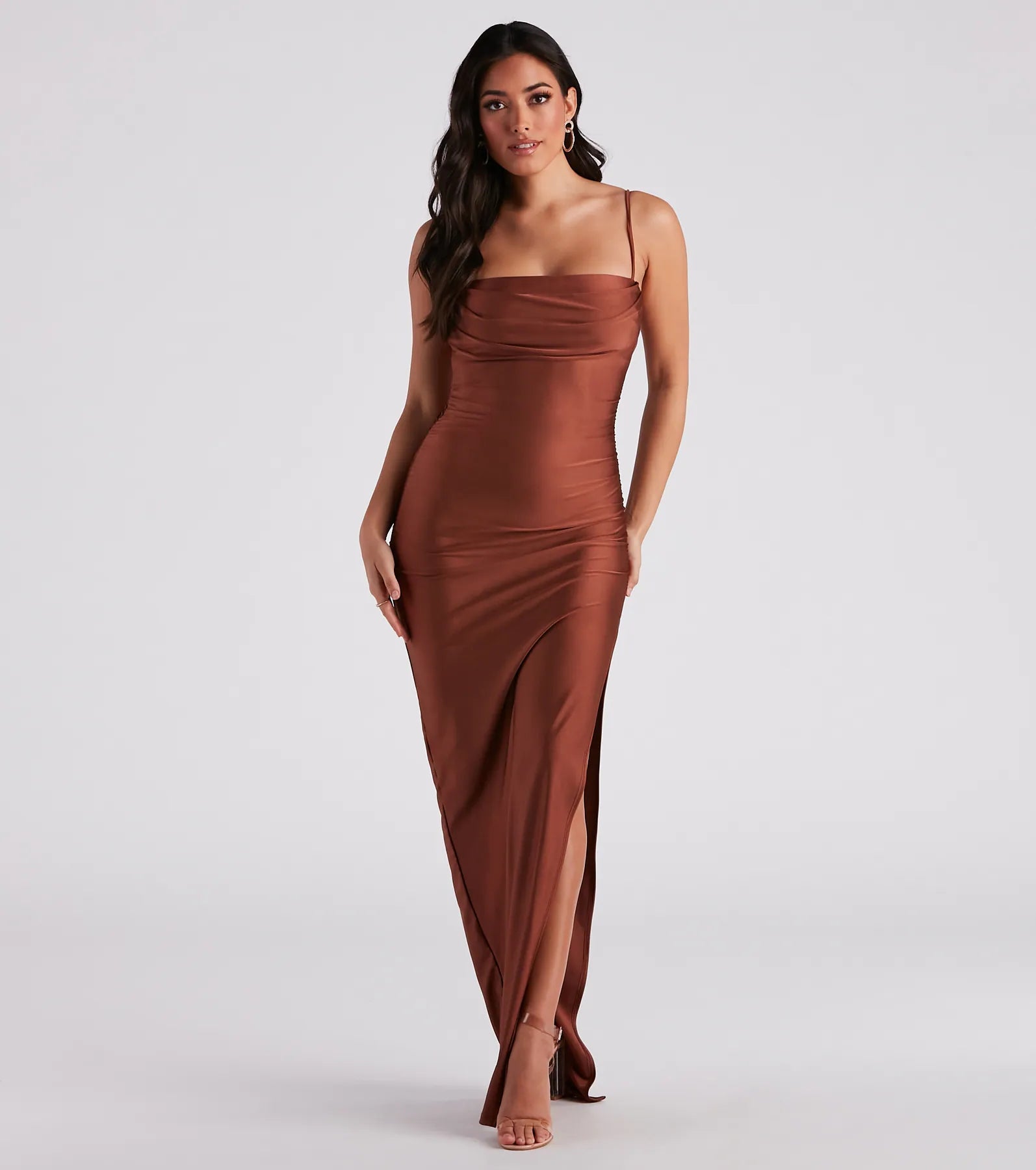Own the spotlight in the Ella Cowl Neck Satin Dress, a brown formal dress crafted to deliver luxe style for fall weddings, military balls, or any special event.