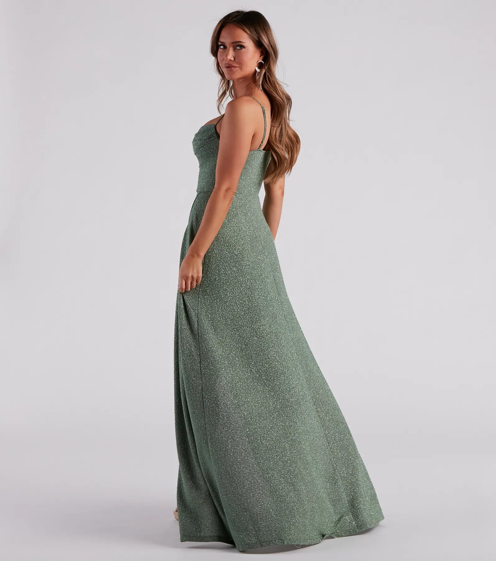 Own the spotlight in the Stephanie Formal Glitter A-Line Dress, a sage green formal dress crafted to deliver luxe style for fall weddings, military balls, or any special event.