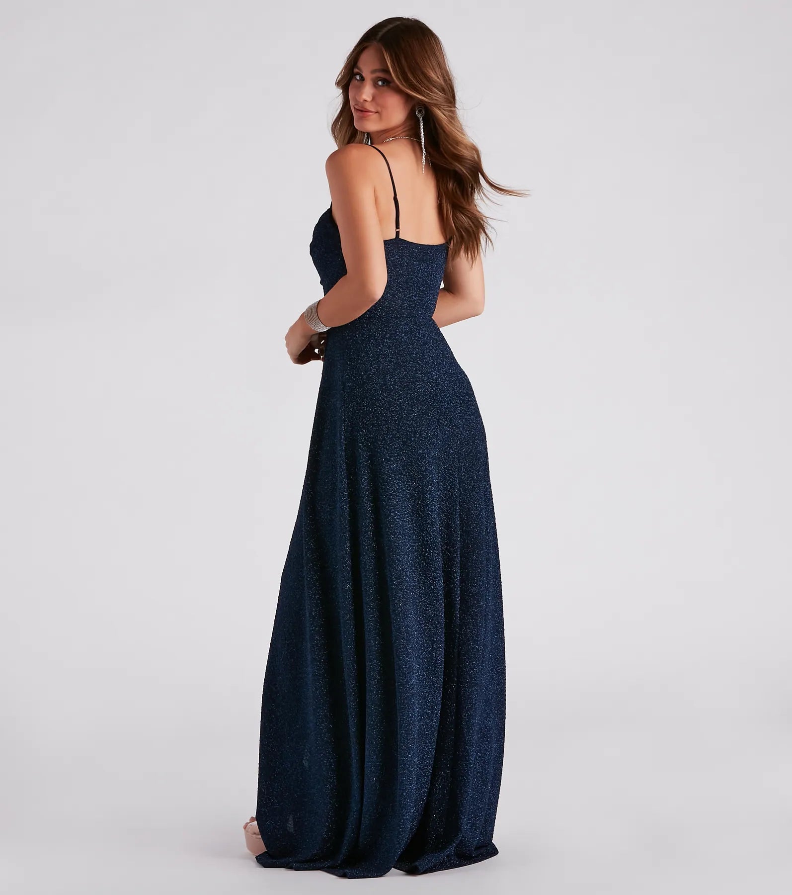 Own the spotlight in the Stephanie Formal Glitter A-Line Dress, a navy blue formal dress crafted to deliver luxe style for fall weddings, military balls, or any special event.