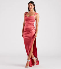 Make a bold statement in the Kirsten Satin Cowl Neck High Slit Formal Dress in pink, the perfect fall dress for weddings, cocktail hours, nights out, and/or seasonal celebrations.