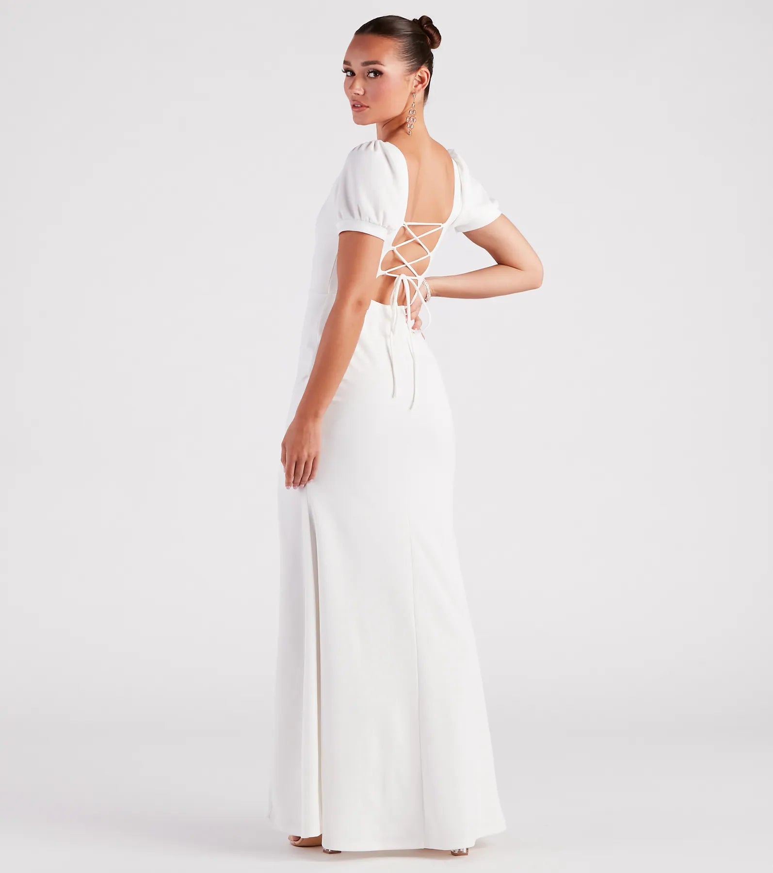 Turn heads at HOCO 2025 in this white homecoming dress, where statement-making details meet the iconic style of the Denali Formal Puff Sleeve Long Dress.