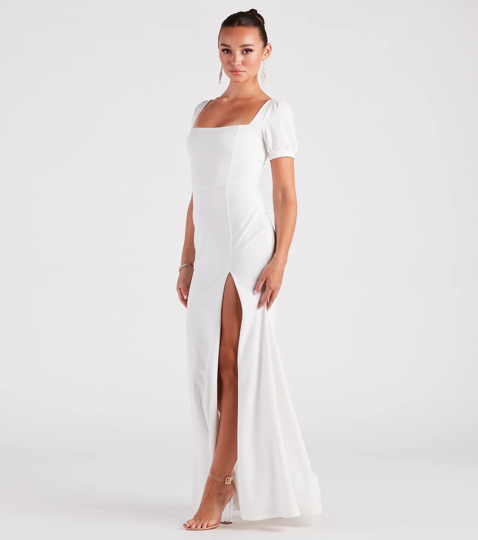 Make a bold statement in the Denali Formal Puff Sleeve Long Dress in white, the perfect fall dress for weddings, cocktail hours, nights out, and/or seasonal celebrations.