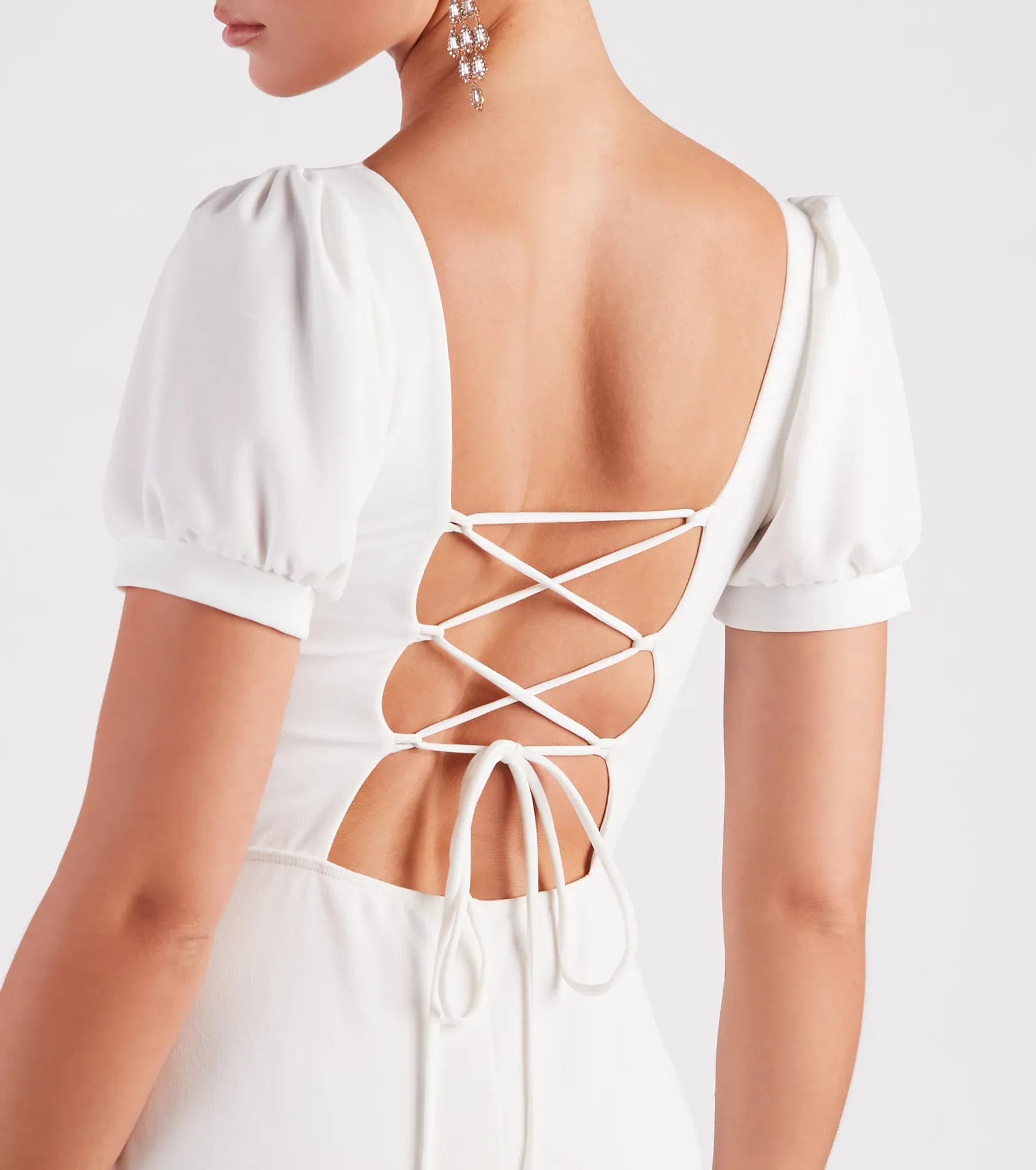 Turn heads at Prom 2025 in this white prom dress, where statement-making details meet the iconic style of the Denali Formal Puff Sleeve Long Dress.