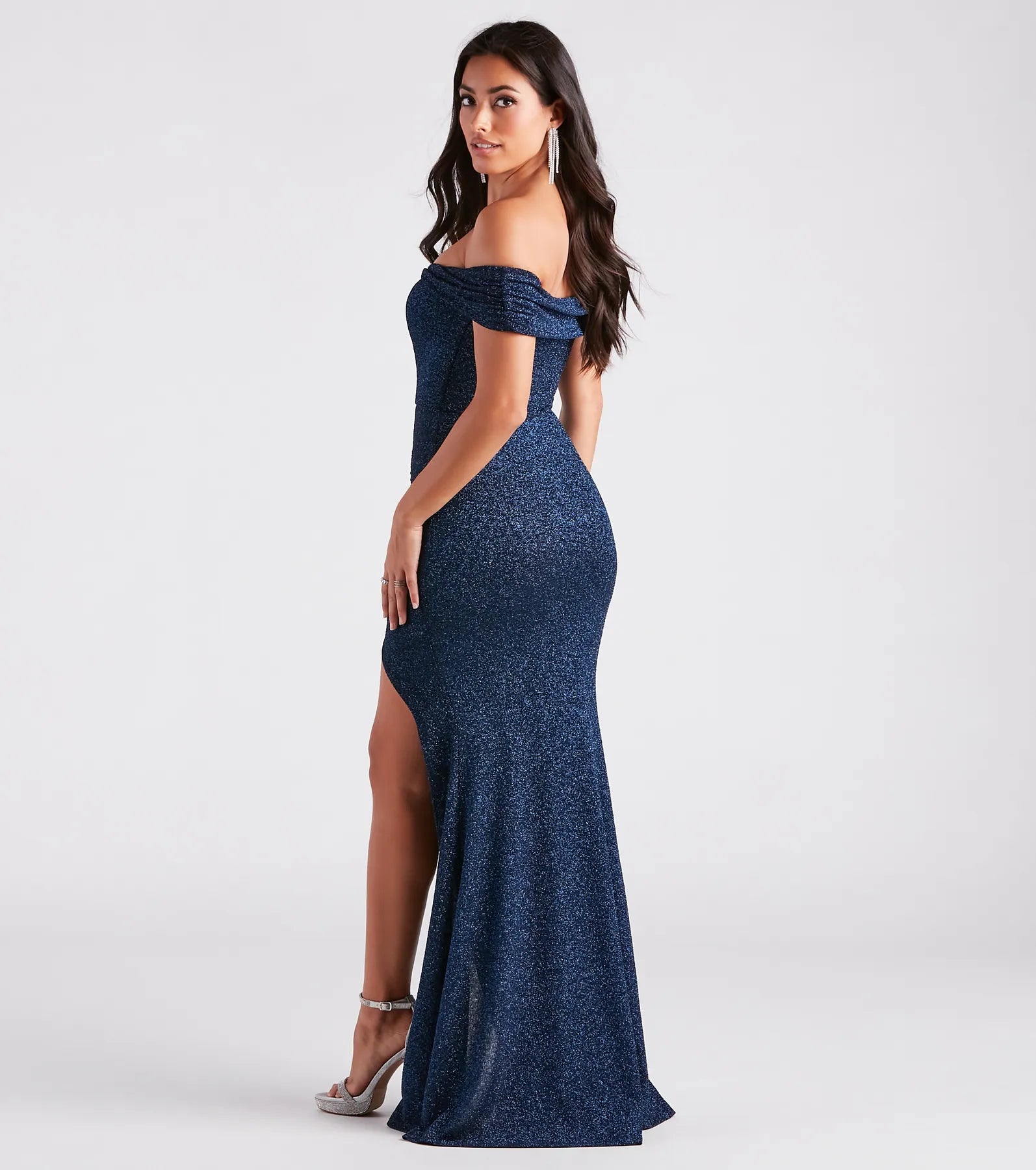 Celebrate in style with the Meryl Formal Glitter Long Dress, a navy blue formal wedding guest dress featuring an elegant silhouette and luxe details, perfect for a black-tie celebration.