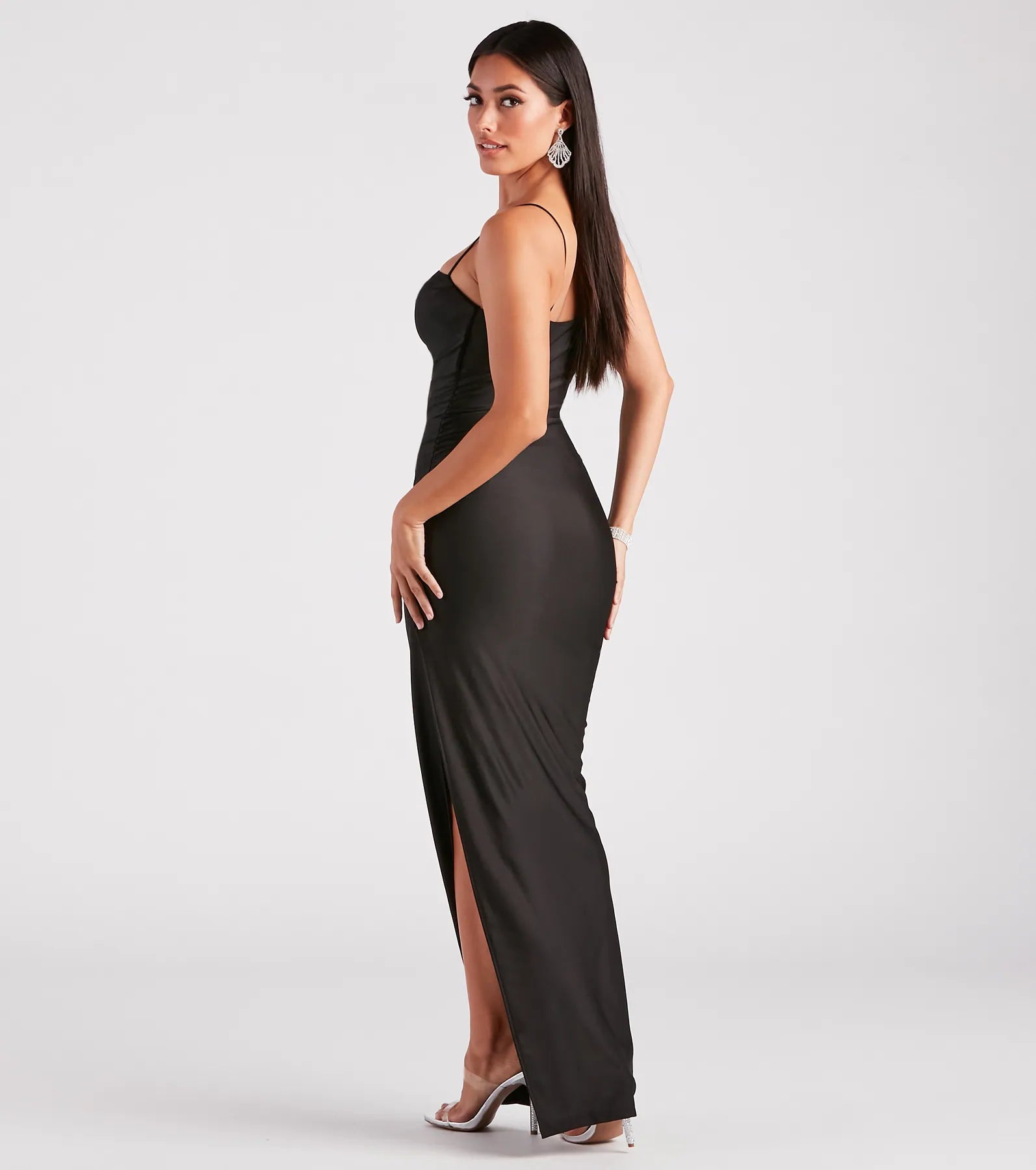 The Ella Cowl Neck Satin Dress is a show-stopping black homecoming dress, offering a sleek, slimming silhouette that enhances your natural beauty for an unforgettable night.