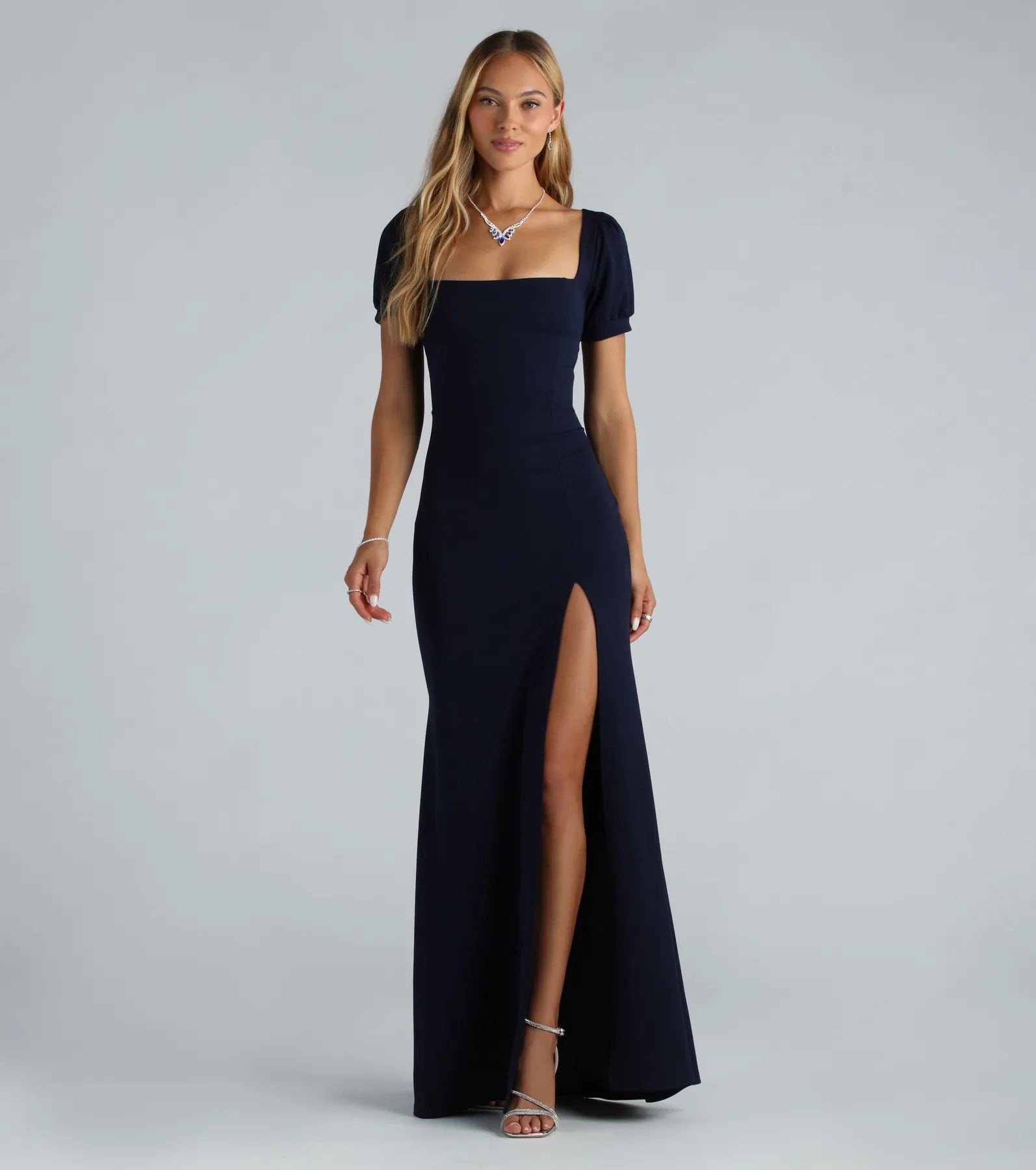 Feel instantly put-together in the Denali Formal Puff Sleeve Long Dress in navy blue, a fall wedding guest dress designed for confident style and all-out celebration.