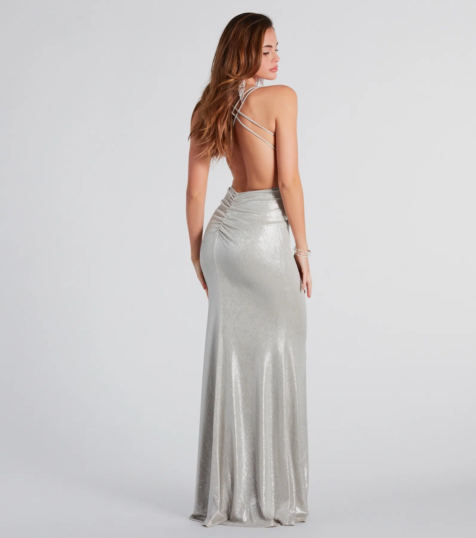Turn heads at Prom 2025 in this silver prom dress, where statement-making details meet the iconic style of the Kate Formal Metallic Open Back Mermaid Dress .