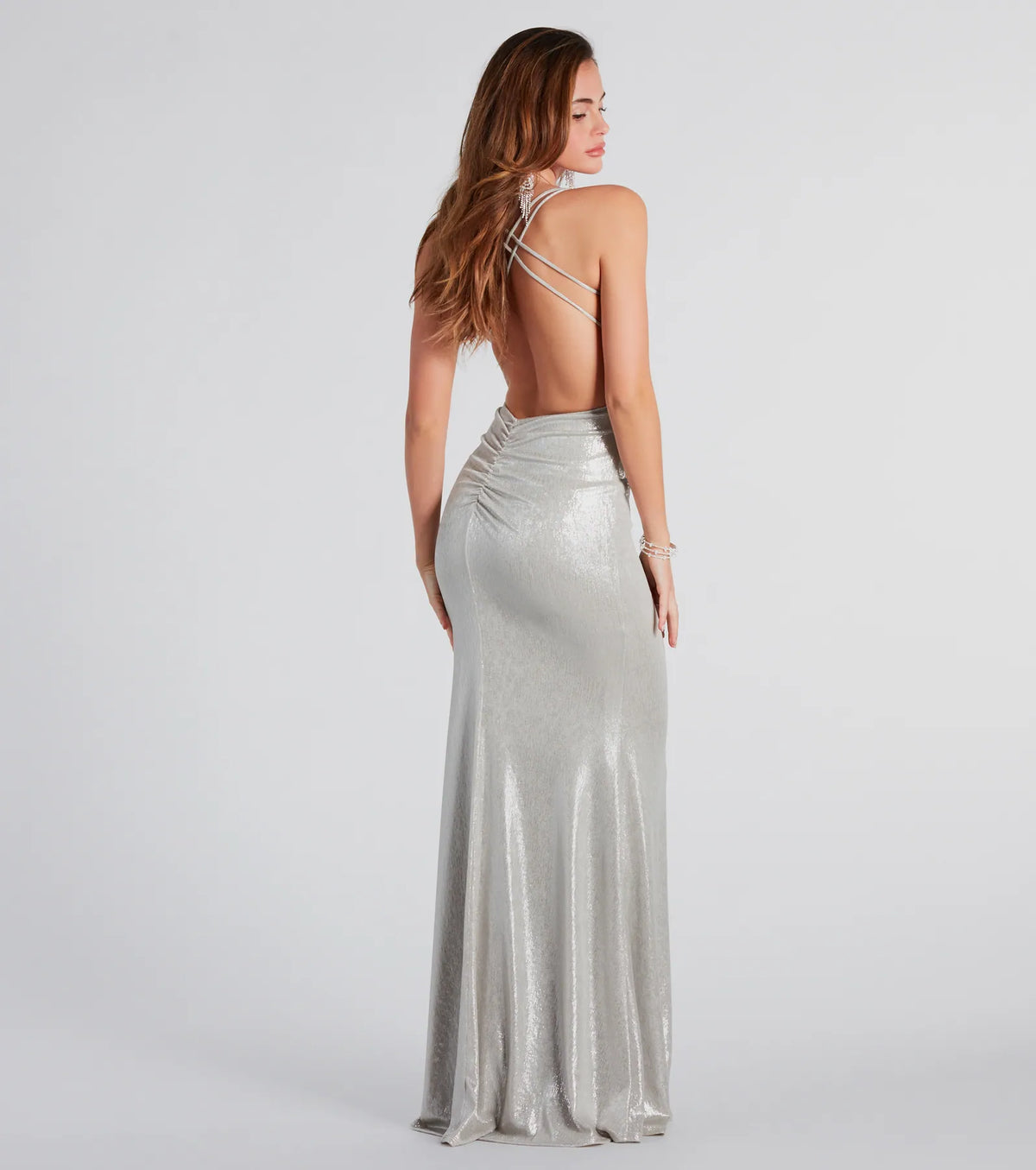Turn heads at Prom 2025 in this silver prom dress, where statement-making details meet the iconic style of the Kate Formal Metallic Open Back Mermaid Dress .