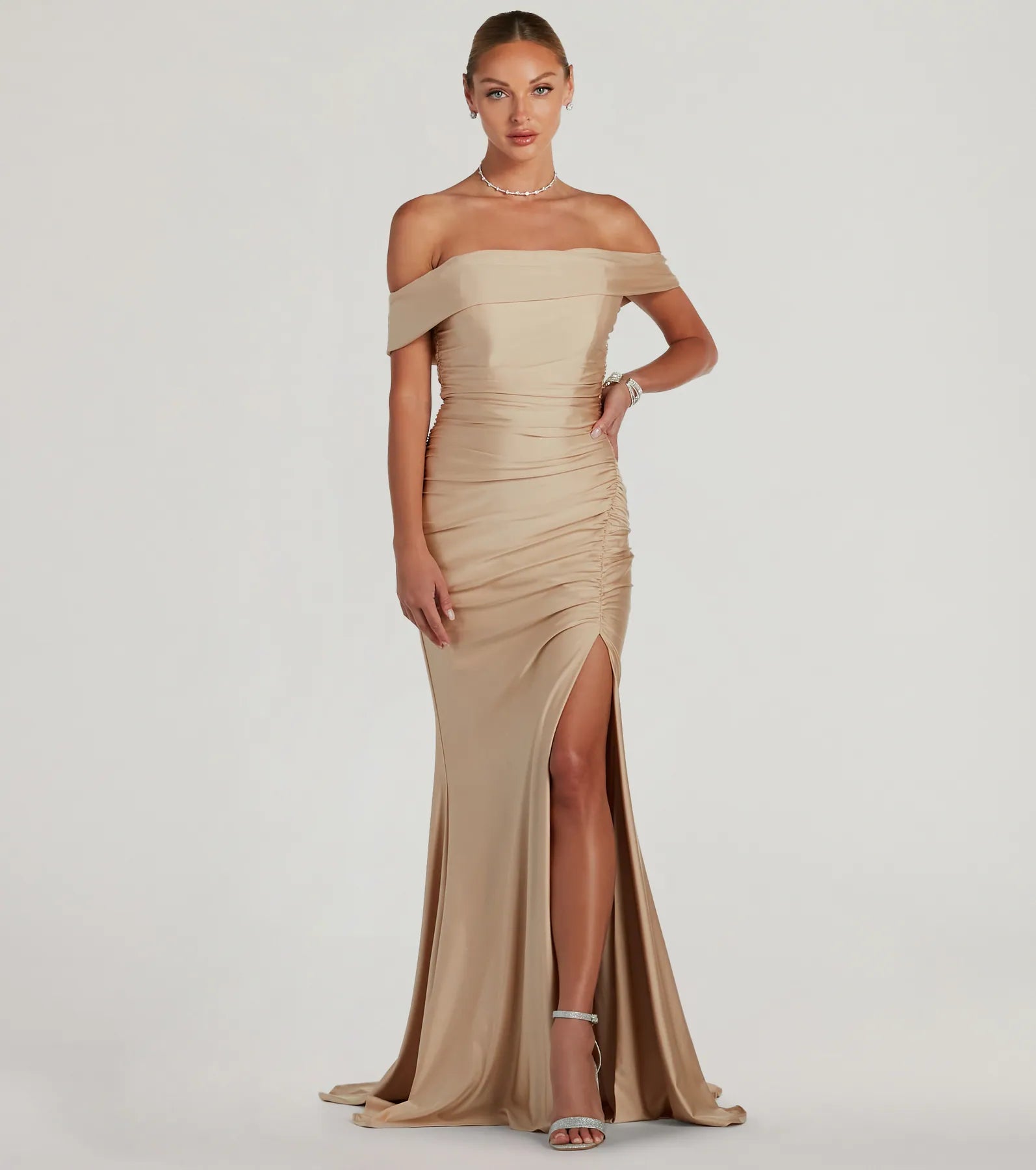 Turn heads at Prom 2025 in this gold prom dress, where statement-making details meet the iconic style of the Alicia Off-The-Shoulder Mermaid Formal Dress .