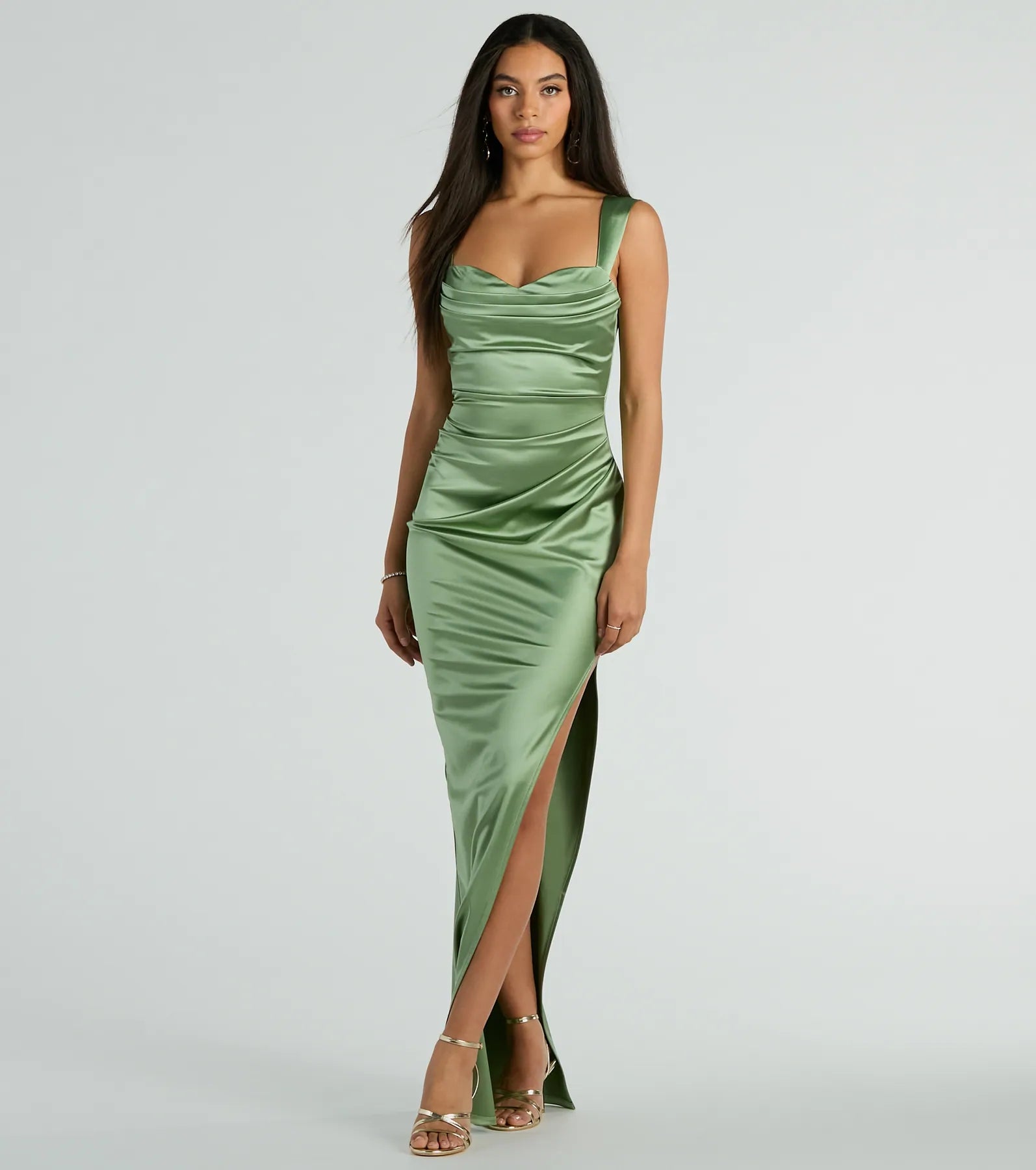 Turn heads at HOCO 2025 in this sage green homecoming dress, where statement-making details meet the iconic style of the Kirsten Satin Cowl Neck High Slit Formal Dress.