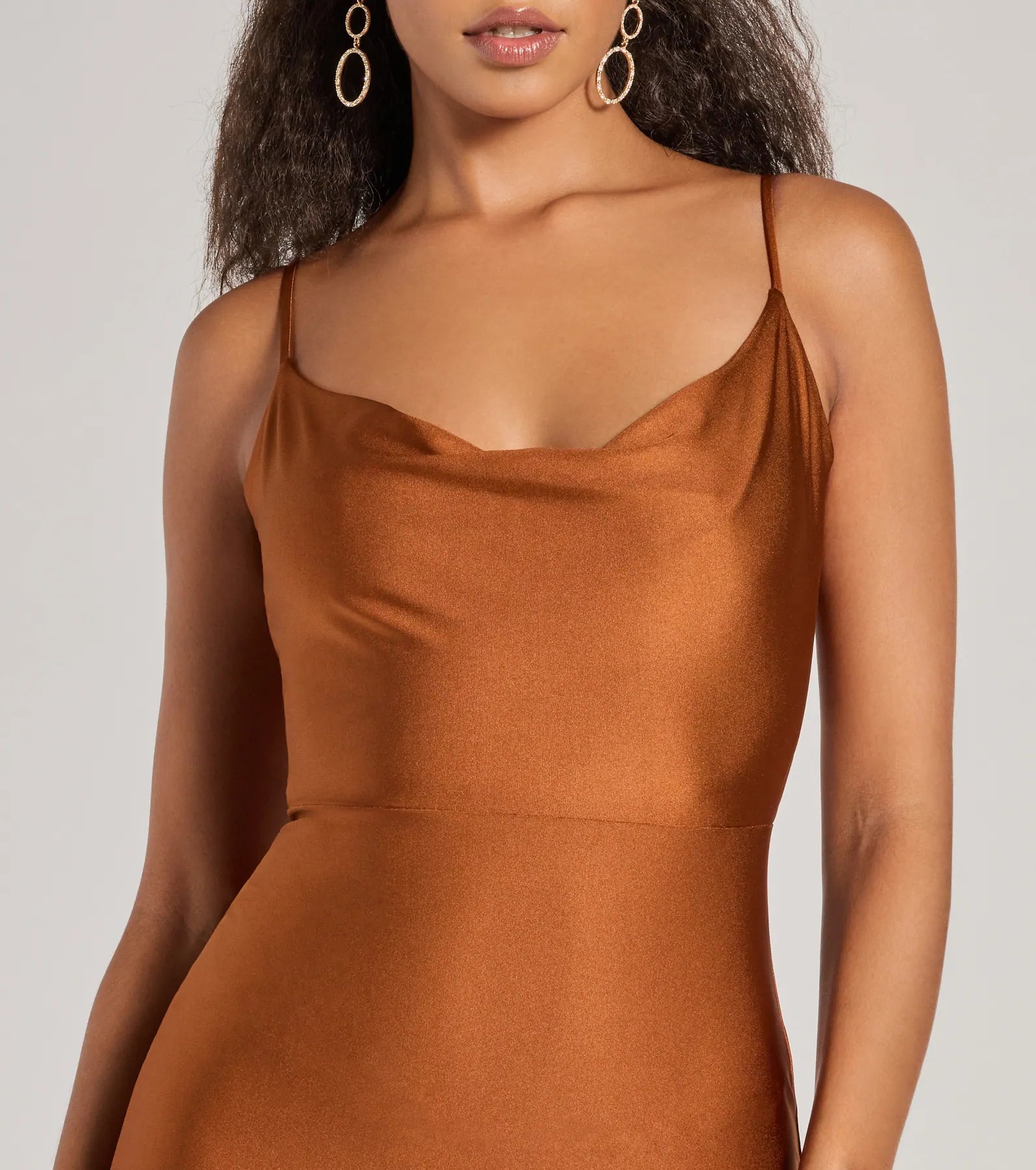 Make a bold statement in the Virginia Cowl Neck Tie-Back Mermaid Formal Dress in copper, the perfect fall dress for weddings, cocktail hours, nights out, and/or seasonal celebrations.