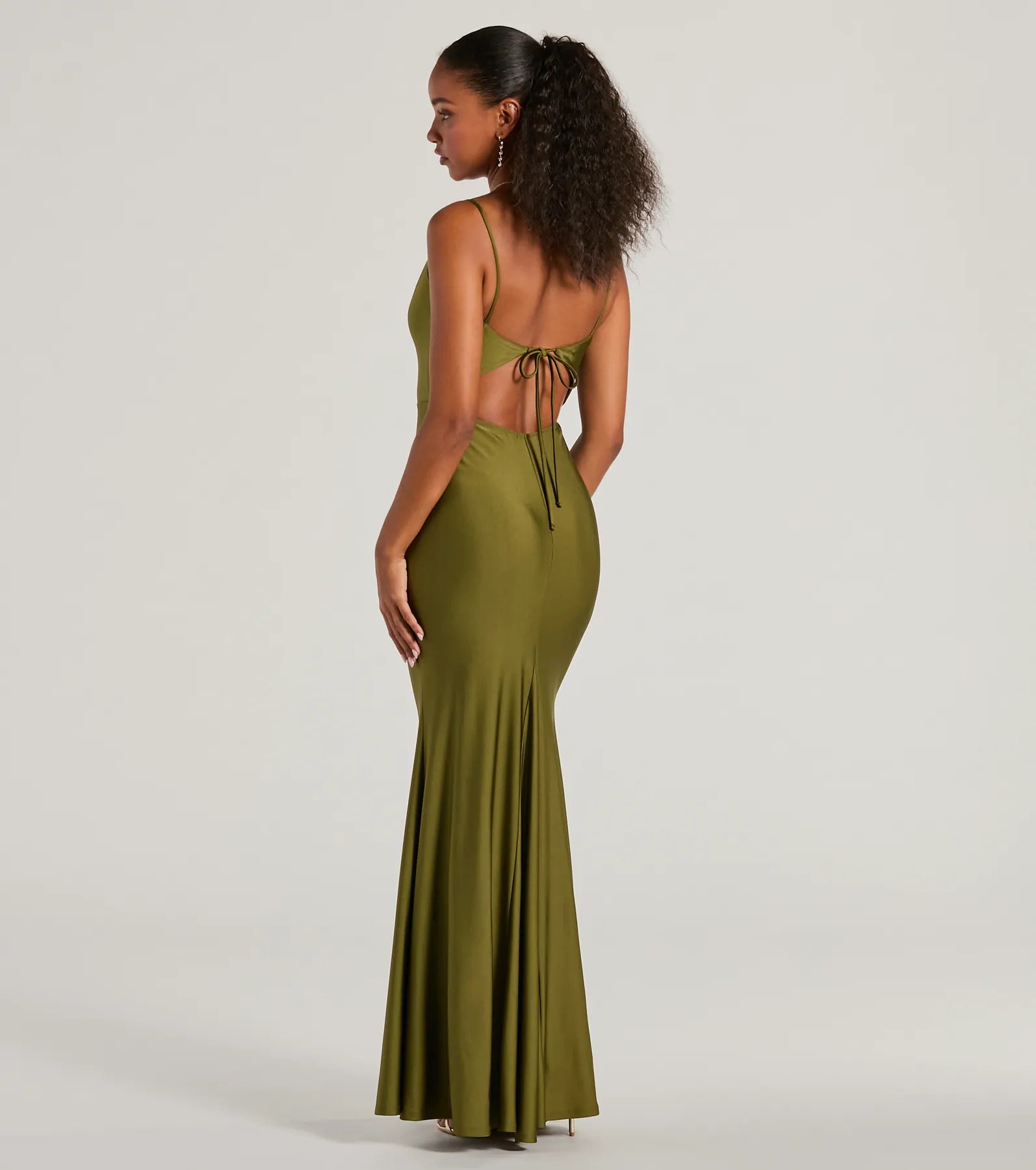 The Virginia Cowl Neck Tie-Back Mermaid Formal Dress in olive is a stunning green prom dress designed to capture attention with its fresh or bold color and effortlessly stylish silhouette.