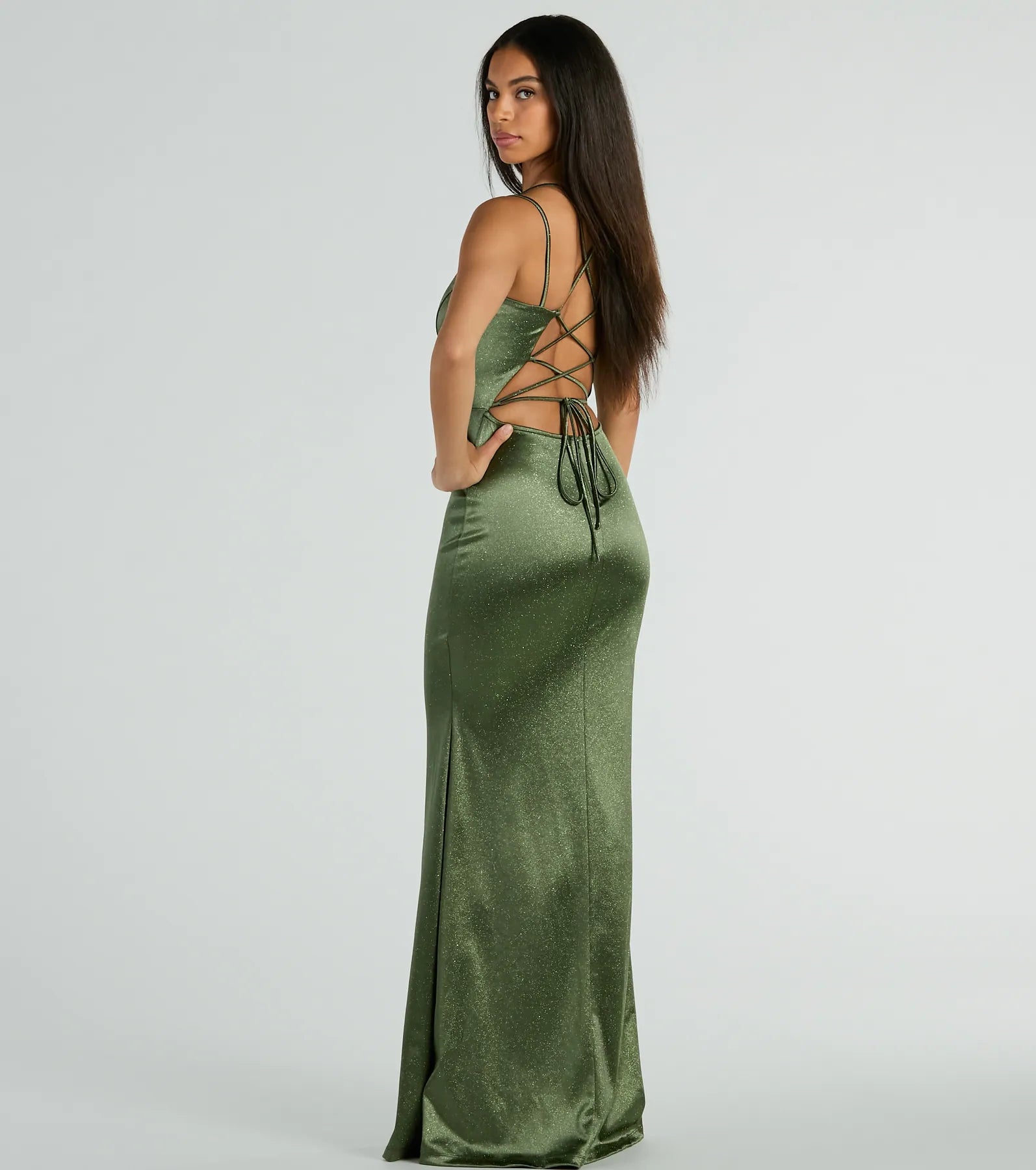 The Macy Lace Up Slim Glitter Satin Formal Dress in olive is a stunning green prom dress designed to capture attention with its fresh or bold color and effortlessly stylish silhouette.