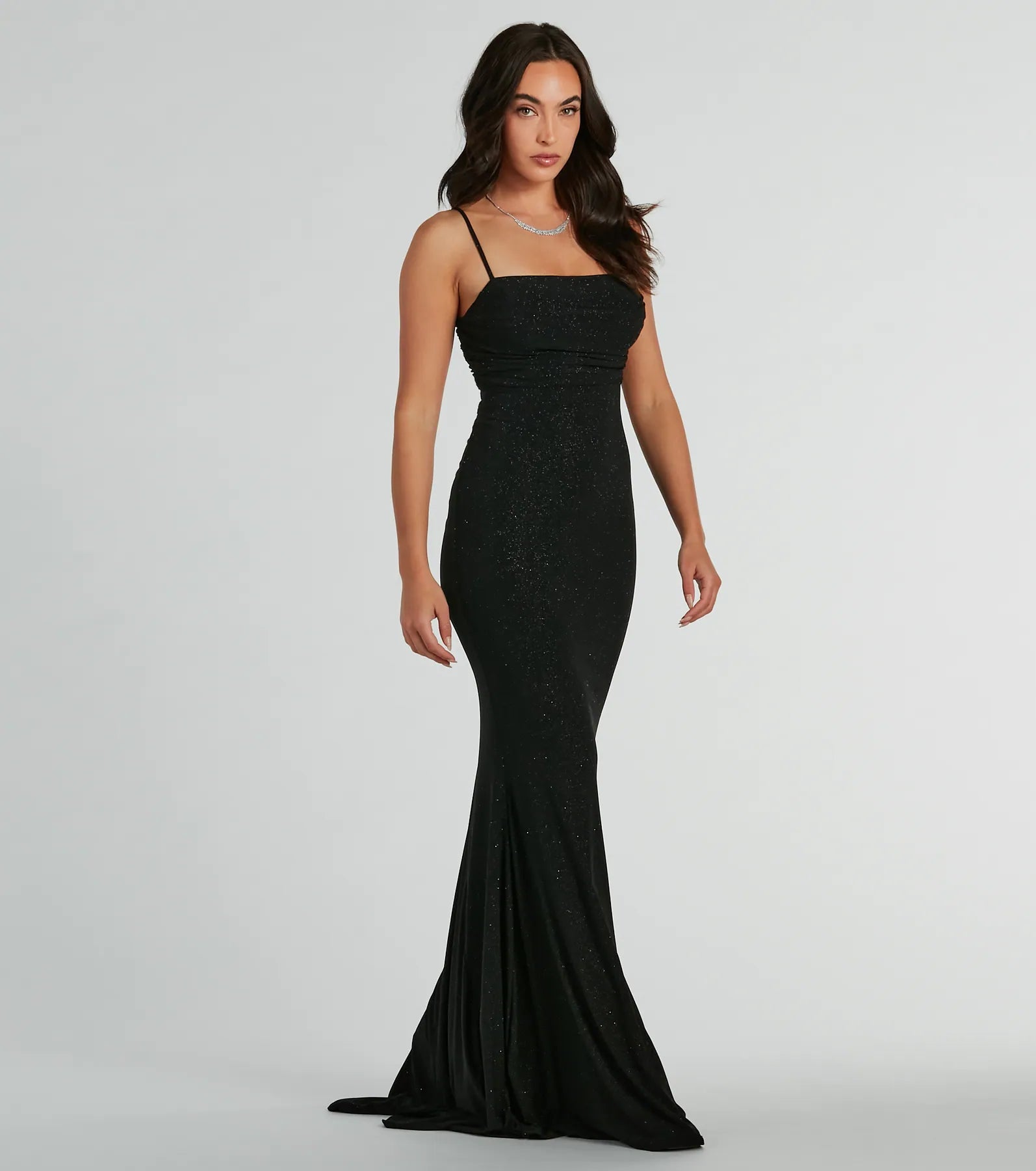 Turn heads at HOCO 2025 in this black homecoming dress, where statement-making details meet the iconic style of the Colleen Lace Up Mermaid Glitter Formal Dress.