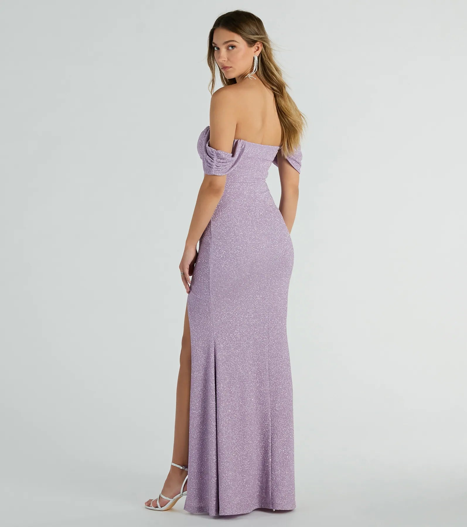Feel instantly put-together in the Tamara Off-The-Shoulder Mermaid Glitter Formal Dress in lavender, a stylish wedding guest dress designed for confident style and all-out celebration.
