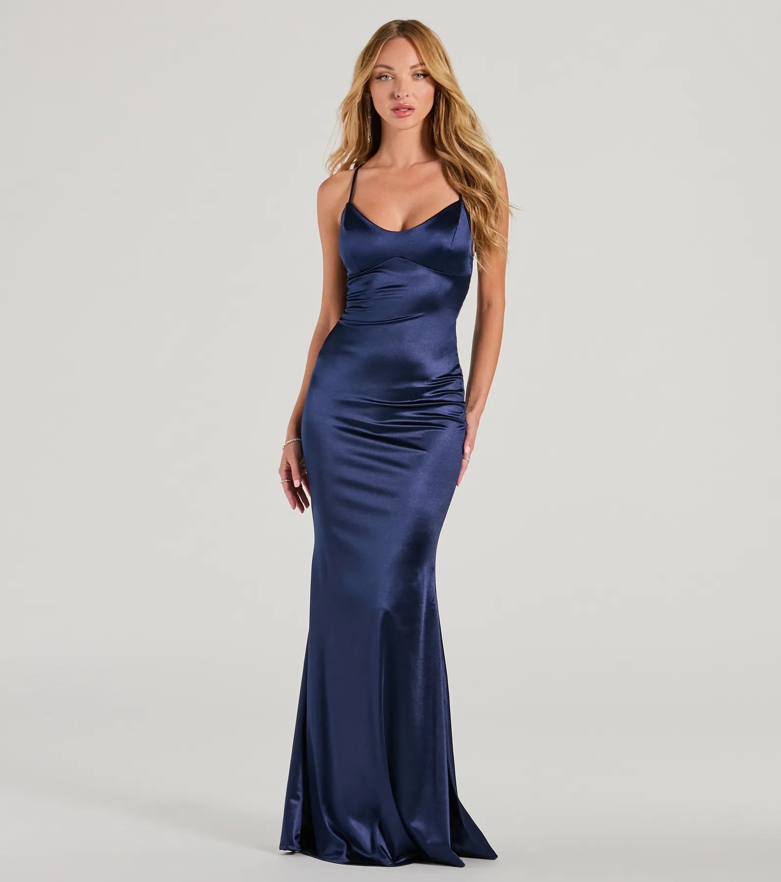 Turn heads at Prom 2025 in this navy blue prom dress, where statement-making details meet the iconic style of the Emmie Lace-Up Mermaid Satin Formal Dress .
