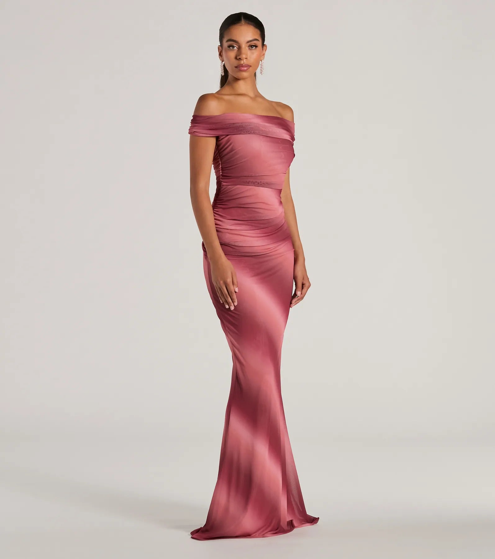 The Abbie Off-The-Shoulder Mermaid Ombre Formal Dress is a flowy, mauve maxi dress that moves with you from sunny days to elevated nights in effortless style.