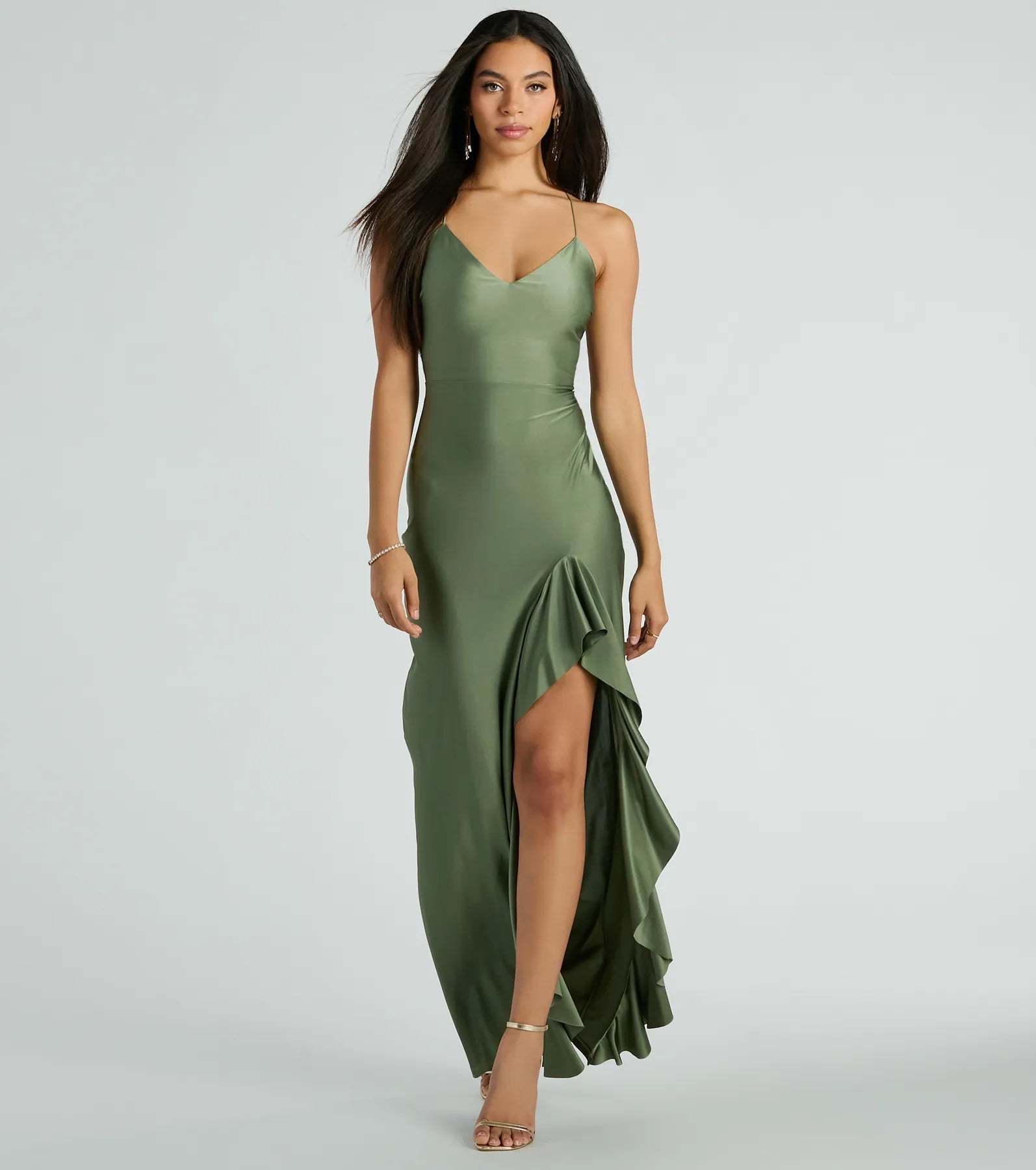 Turn heads at Prom 2025 in this sage green prom dress, where statement-making details meet the iconic style of the Lainey Ruffled High Slit Long Formal Dress .