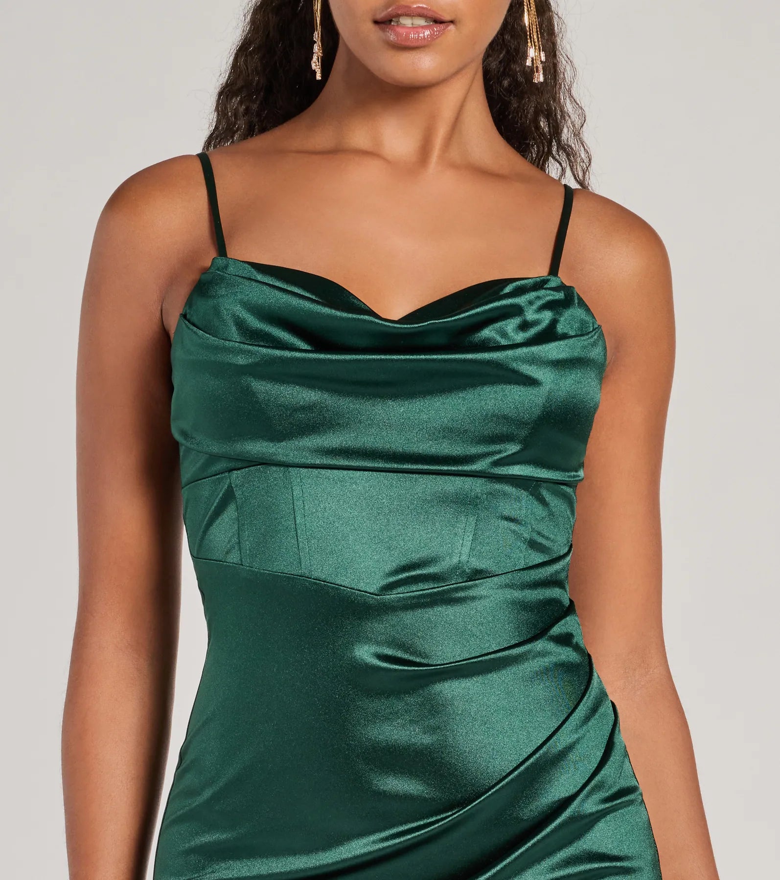 Make a bold statement in the Iliana Cowl Neck High Slit Satin Column Dress in hunter green, the perfect green dress for weddings, cocktail hours, nights out, and/or seasonal celebrations.