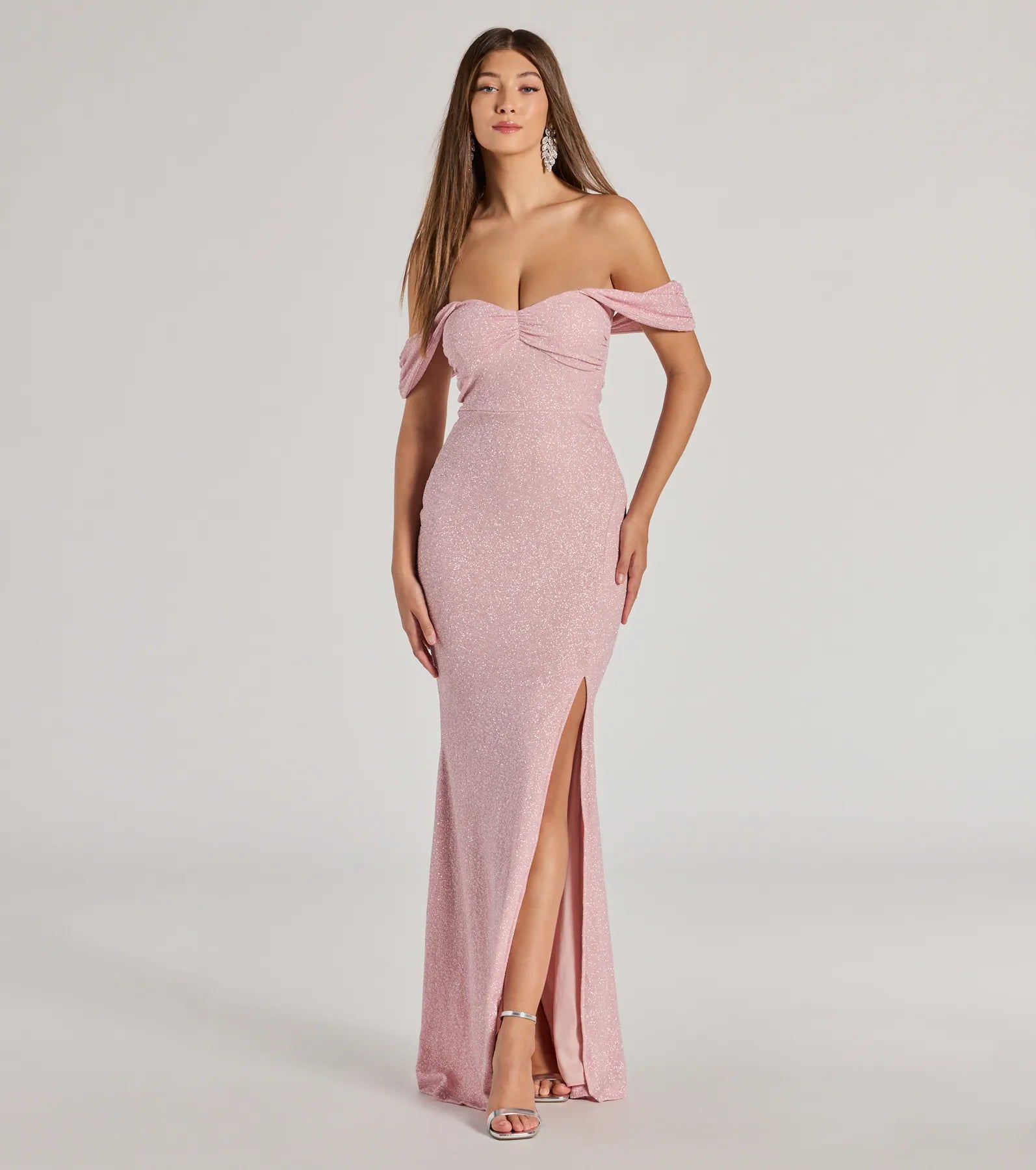 Turn heads at Prom 2025 in this pink prom dress, where statement-making details meet the iconic style of the Tamara Off-The-Shoulder Mermaid Glitter Formal Dress .