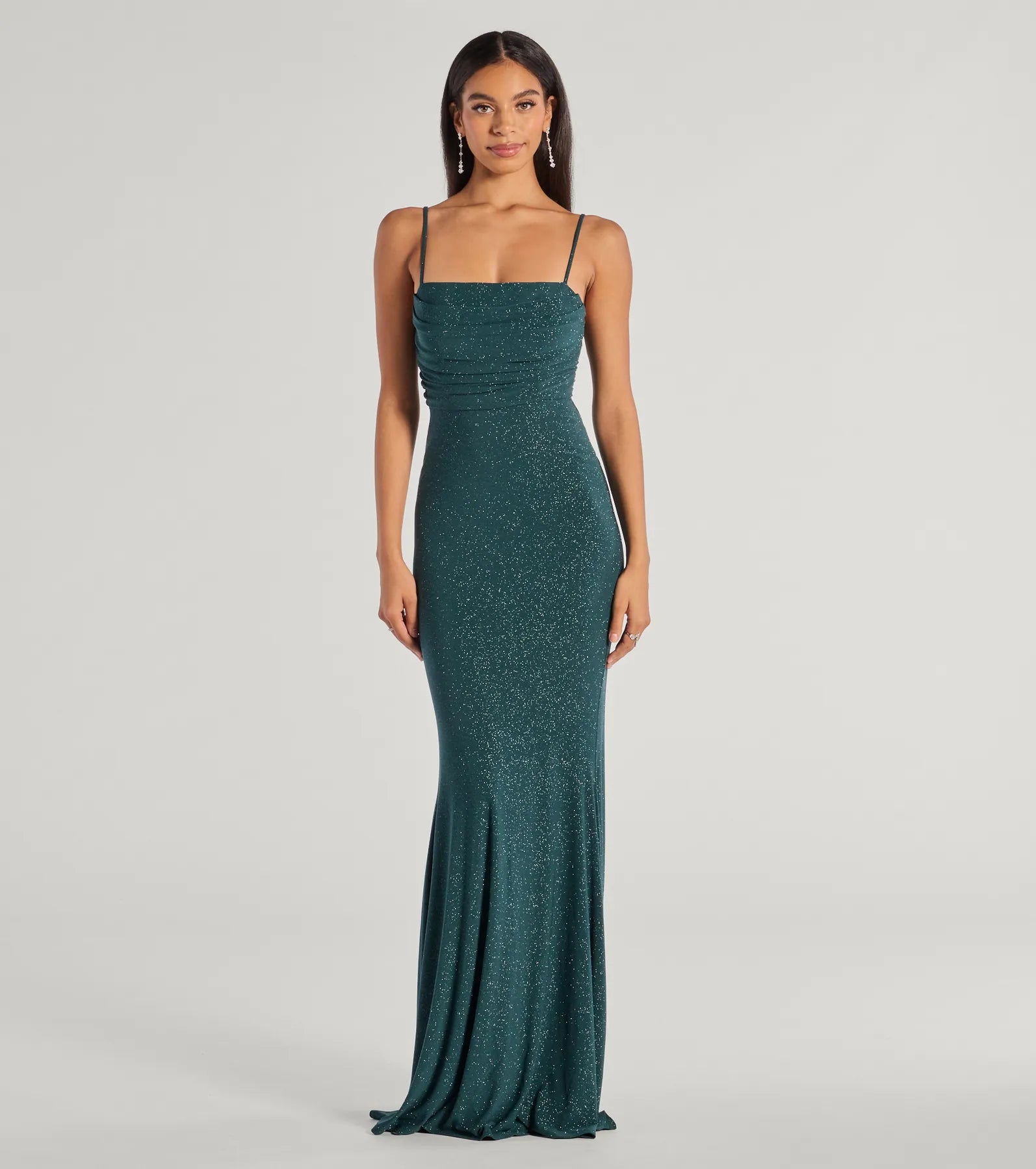Turn heads at HOCO 2025 in this hunter green homecoming dress, where statement-making details meet the iconic style of the Colleen Lace Up Mermaid Glitter Formal Dress.