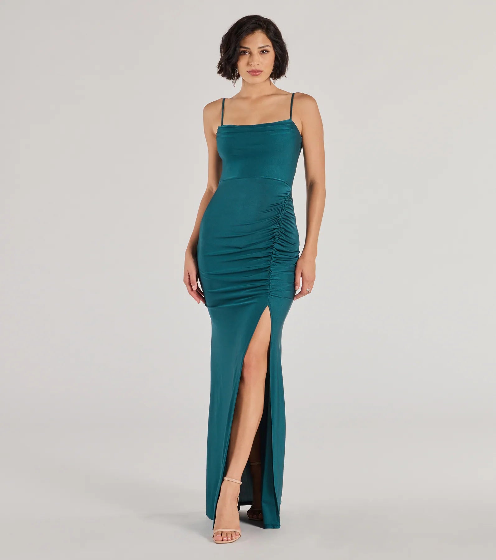Turn heads at Prom 2025 in this hunter green prom dress, where statement-making details meet the iconic style of the Marsha Cowl Neck Mermaid Formal Dress .