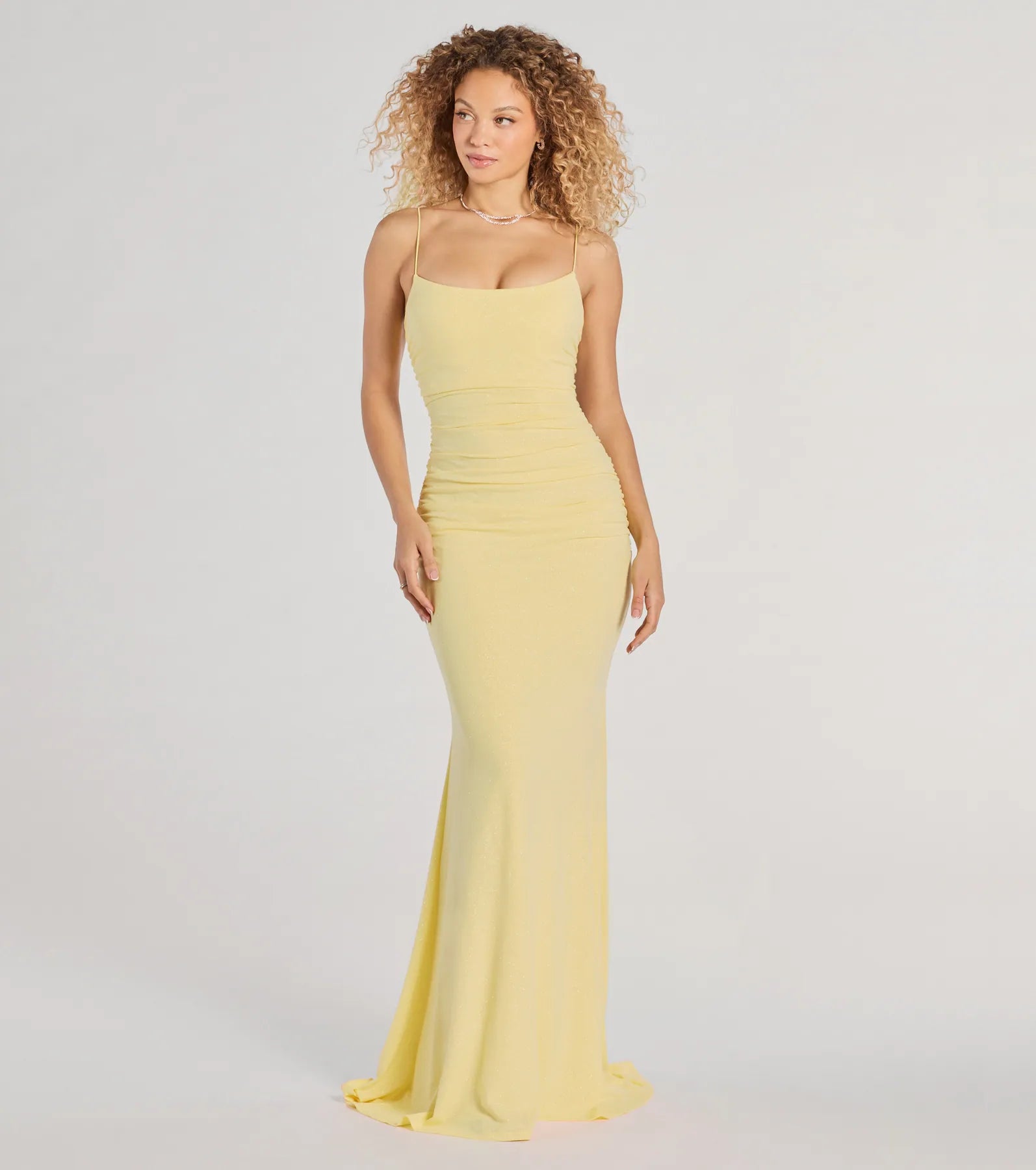 Turn heads at Prom 2025 in this yellow prom dress, where statement-making details meet the iconic style of the Rowan Formal Glitter Ruched Mermaid Dress .