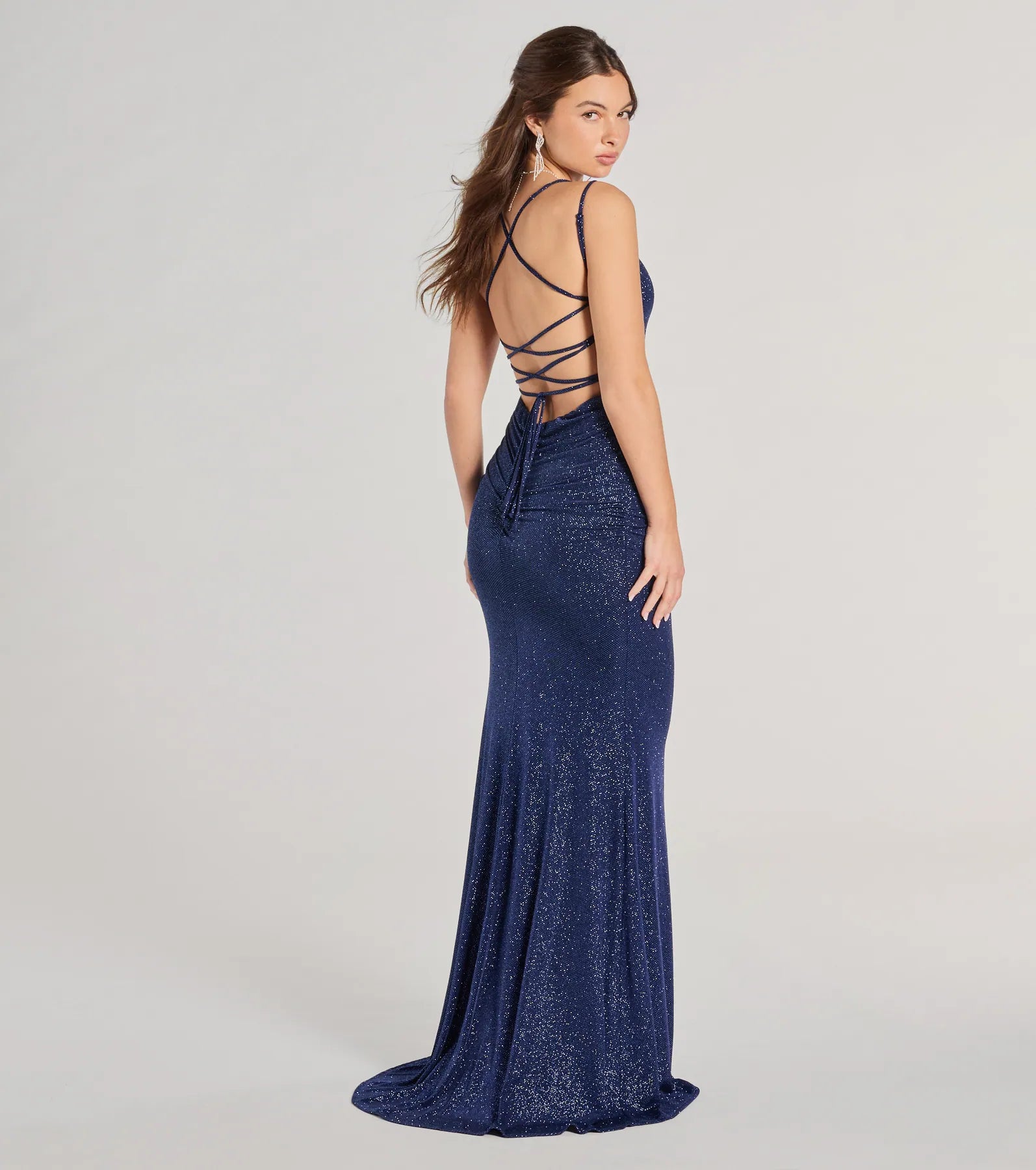 Own every entrance in the Rylie Formal Glitter Lace-Up Column Dress, a navy blue party dress perfect for milestone birthdays and grad parties, or dancing through weekend nights and unforgettable bachelorette celebrations.