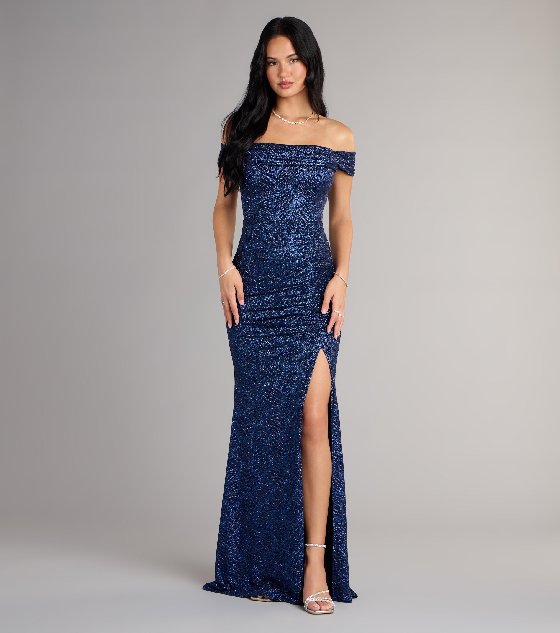 The Alina Glitter Off-The-Shoulder Mermaid Formal Dress is your new go-to Windsor dress—effortless, versatile, and made to update your fall style in seconds.
